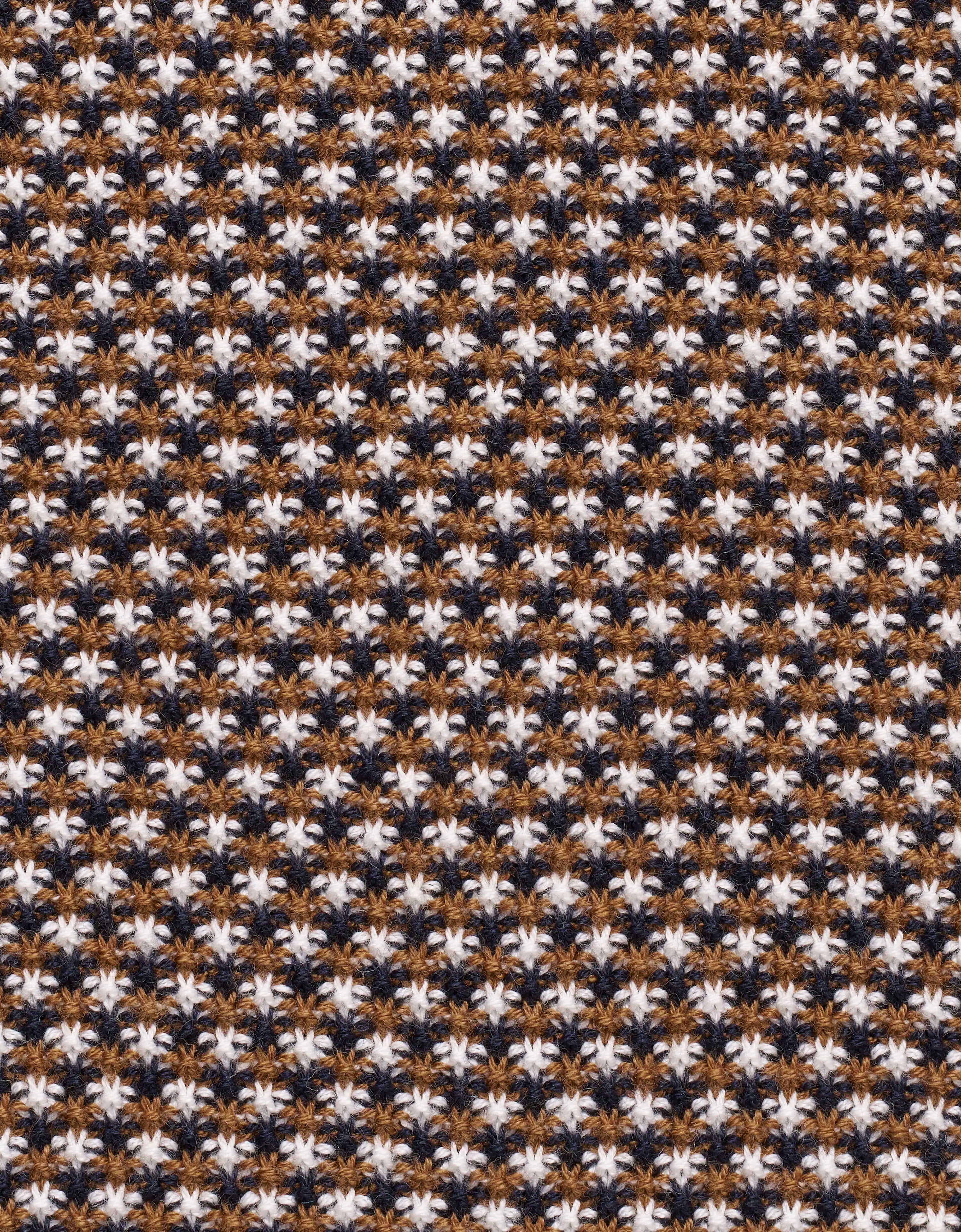 Hahnentrittmuster in Braun, Weiß und Schwarz.