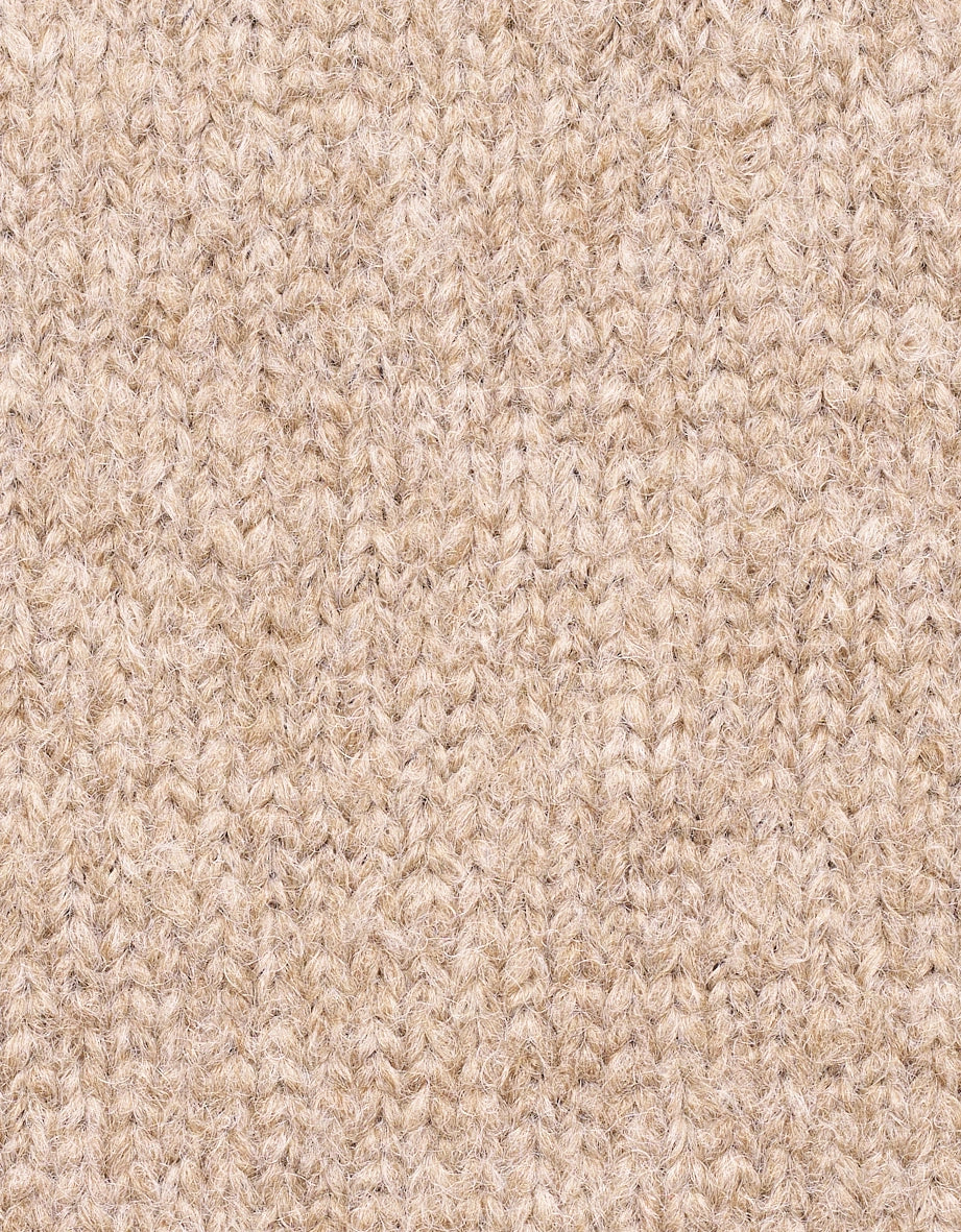 Beiges Strickmuster, Detailaufnahme des Stoffes, zeigt Textur und Qualität des Materials.