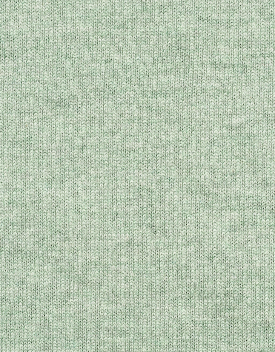 Green knit fabric, close-up, texture details.