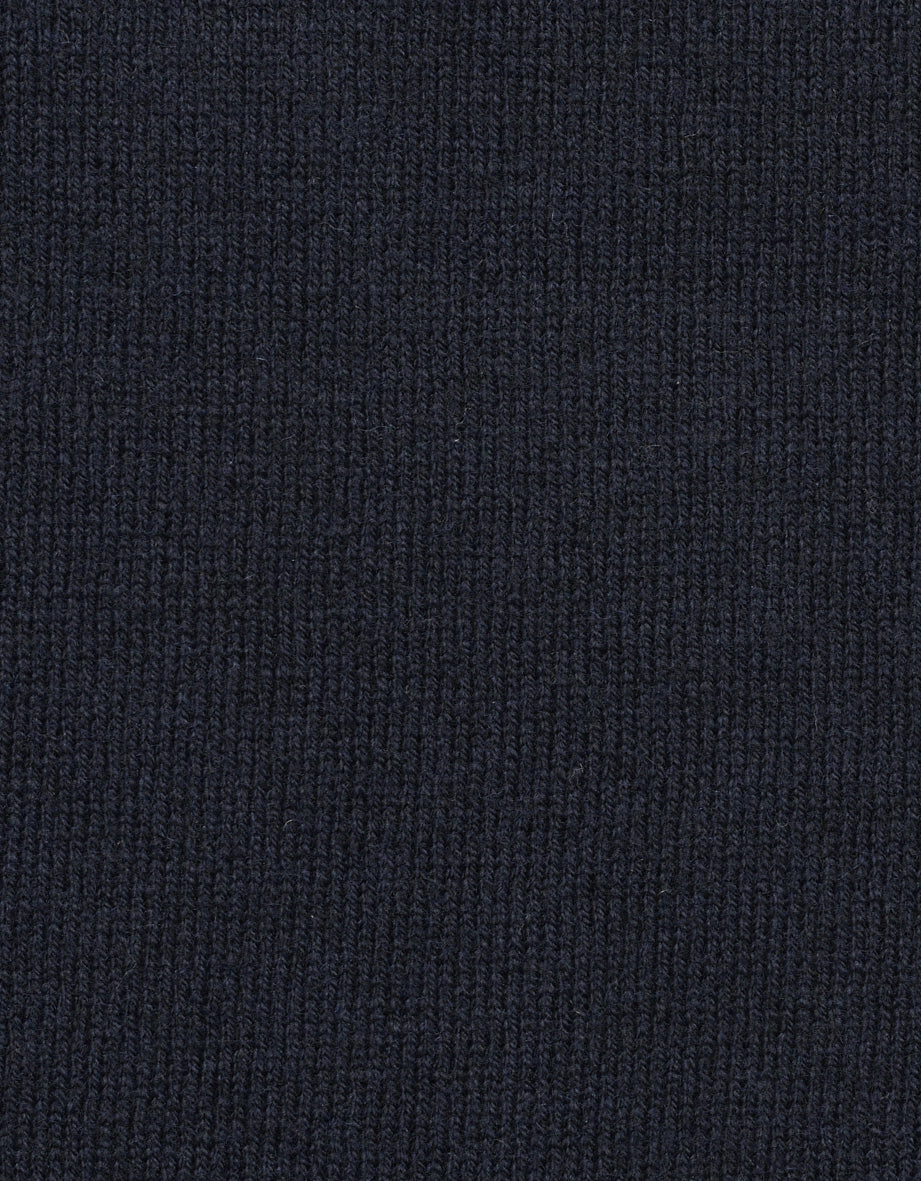Dark blue knit fabric, detailed, close-up, showcasing texture and quality.