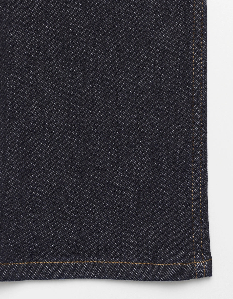 Close-up of dark blue denim with gold stitching, classic design, bugatti style.