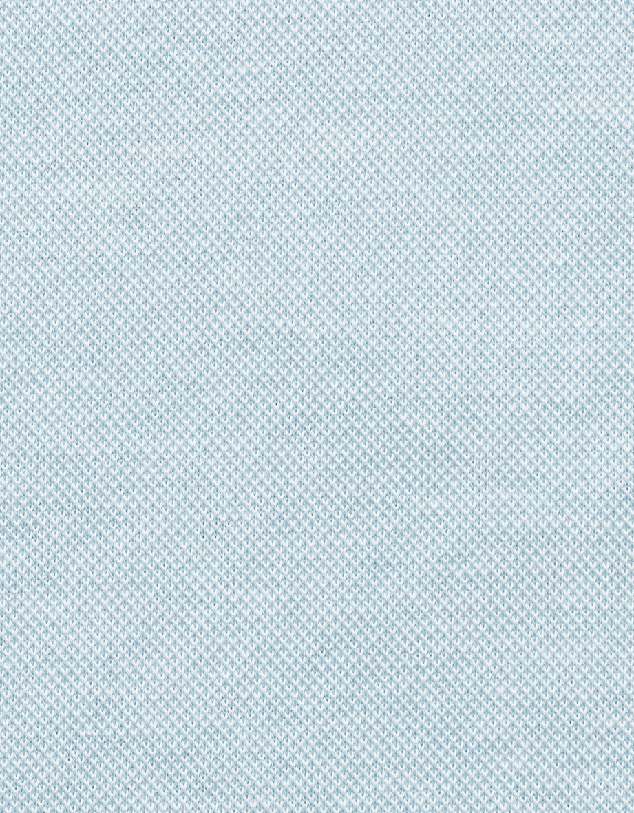 Light blue fabric with fine knit texture, close-up.