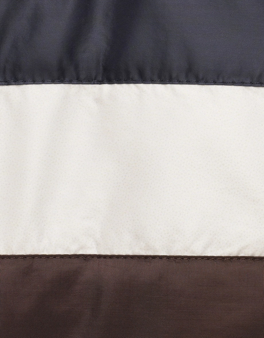 Three-tone fabric in black, beige, and brown by bugatti, smooth and elegant, detailed texture.