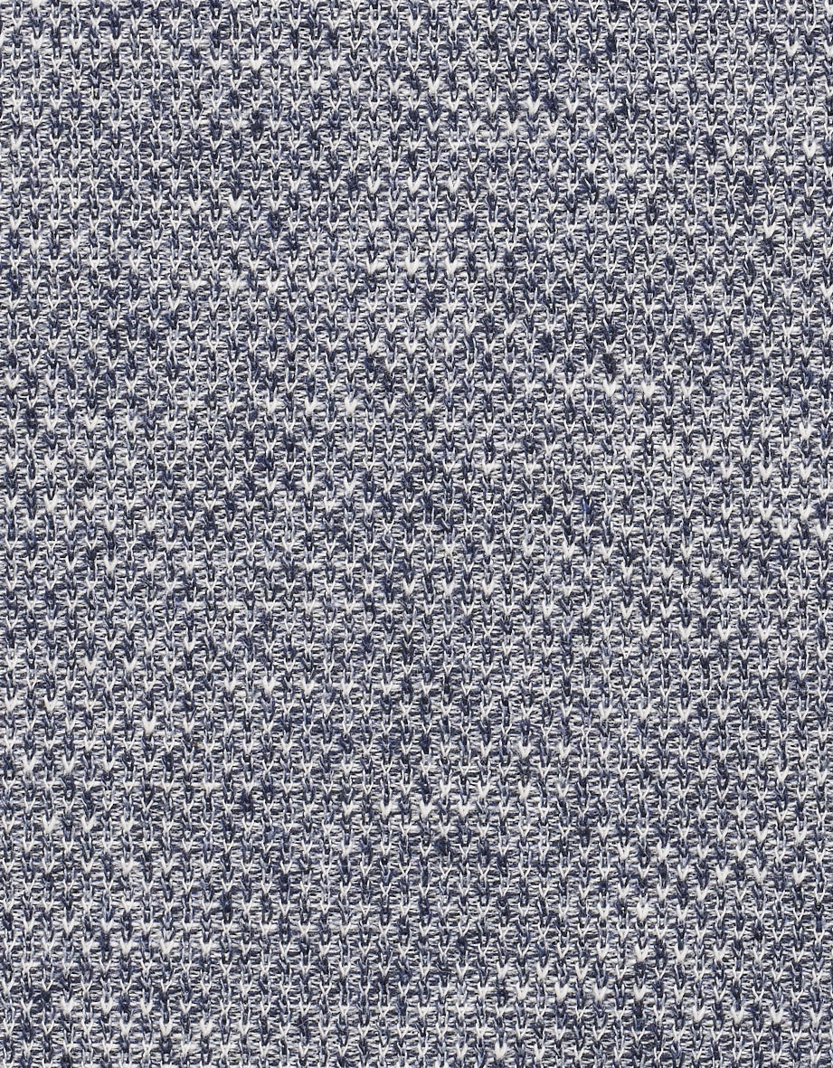 Man in grey patterned bugatti blazer and dark blue shirt, relaxed pose.