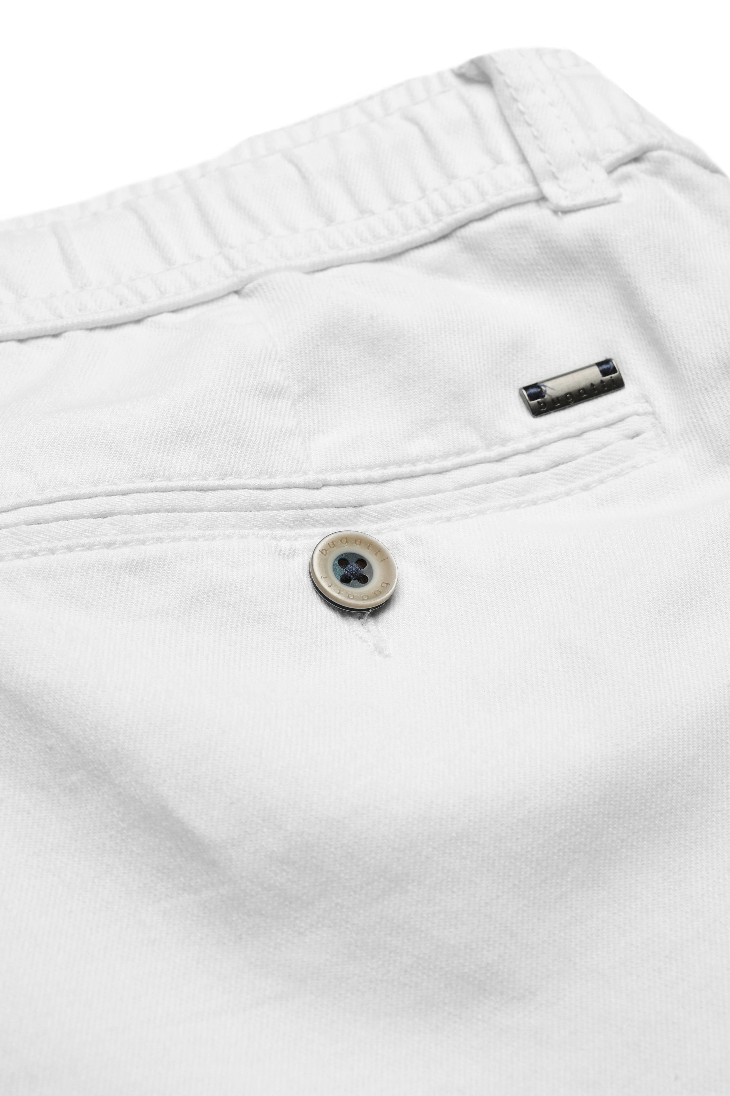 White bugatti trousers, close-up with button and logo. Bust image.