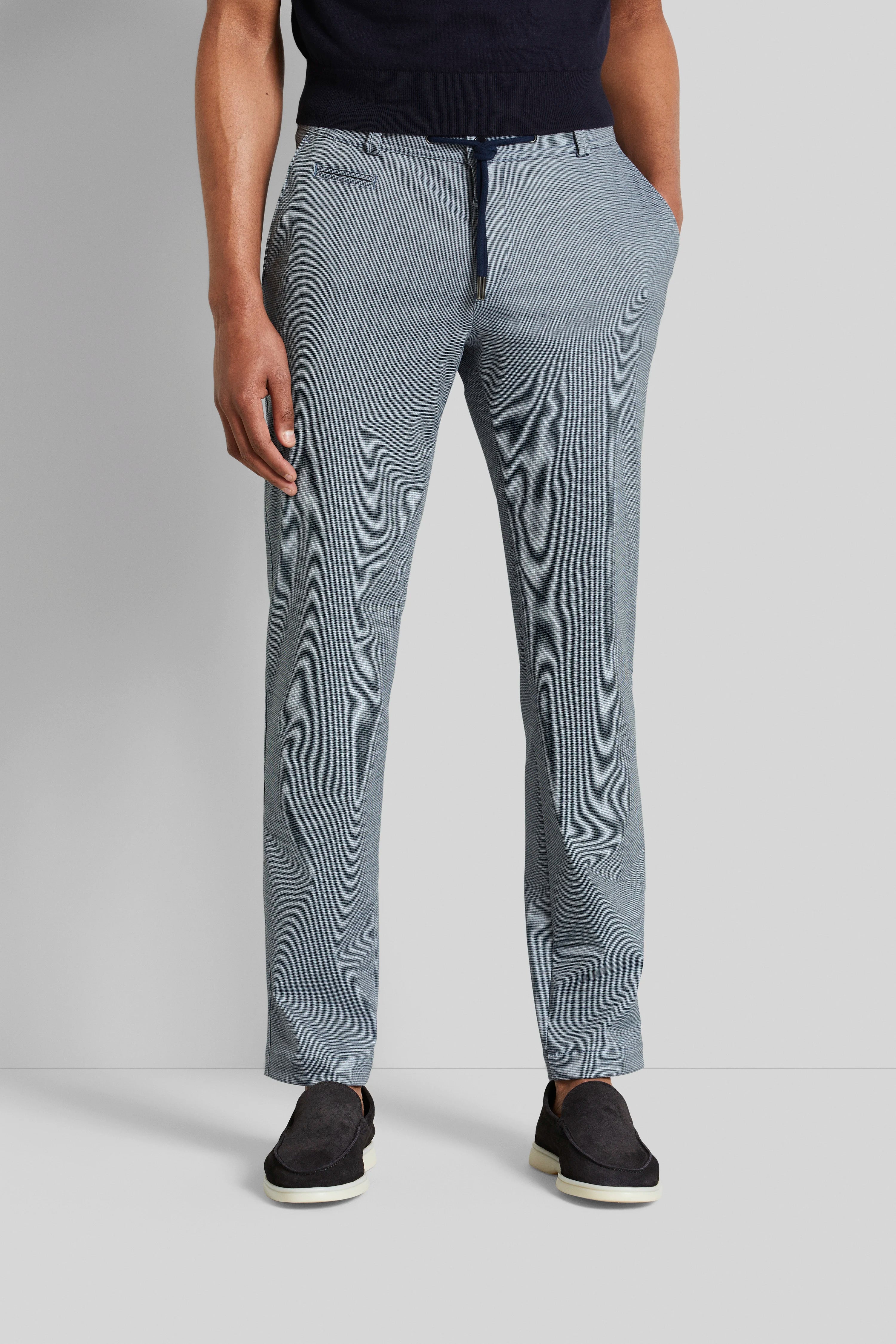 Gray bugatti pants with fine pattern, casual model pose, hands in pockets, black loafers.