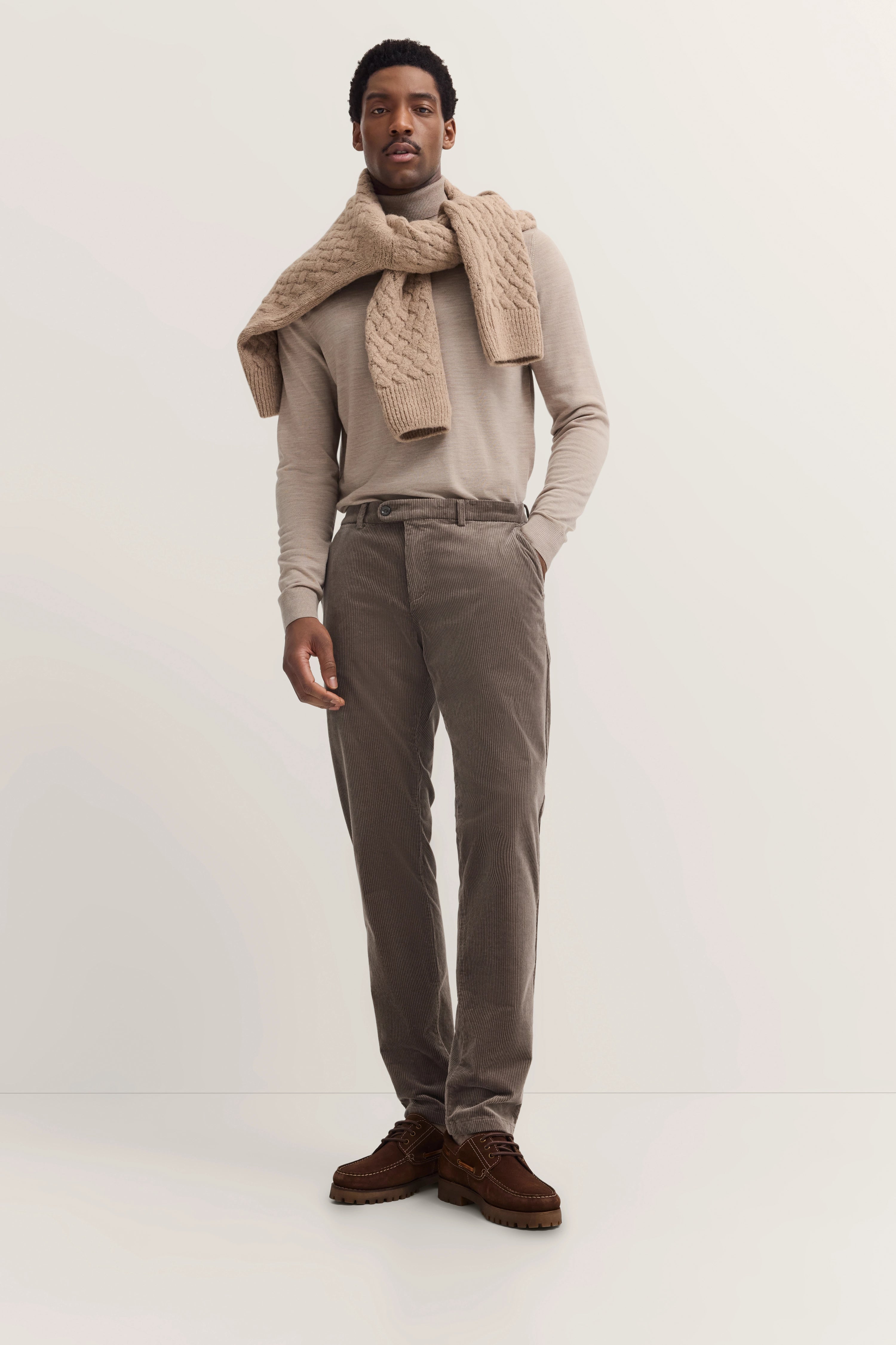 Beige turtleneck, knit scarf, taupe corduroy pants, brown shoes by bugatti.