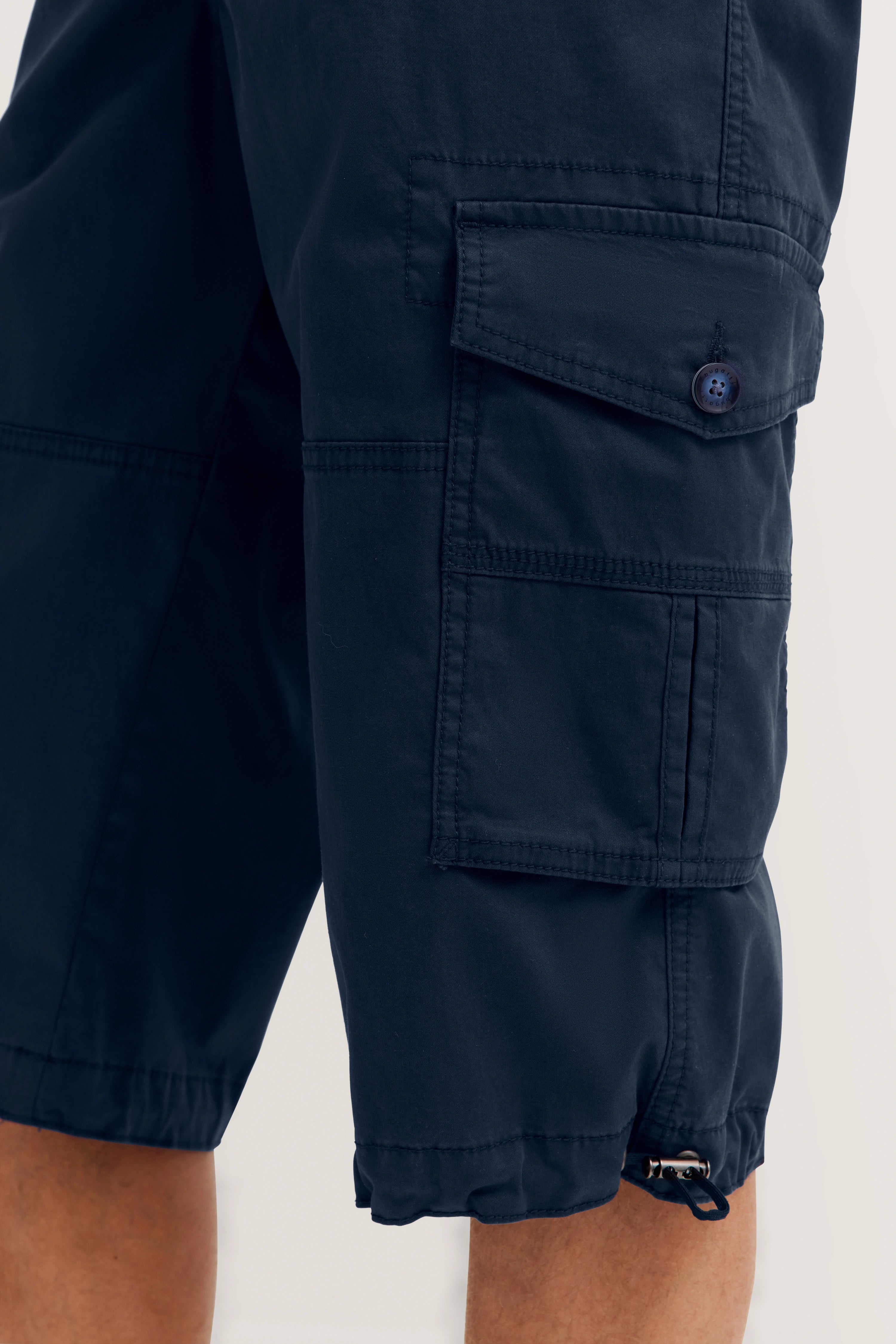 bugatti navy cargo shorts, relaxed style, close-up of side pockets, embodying Italian-inspired sophistication.