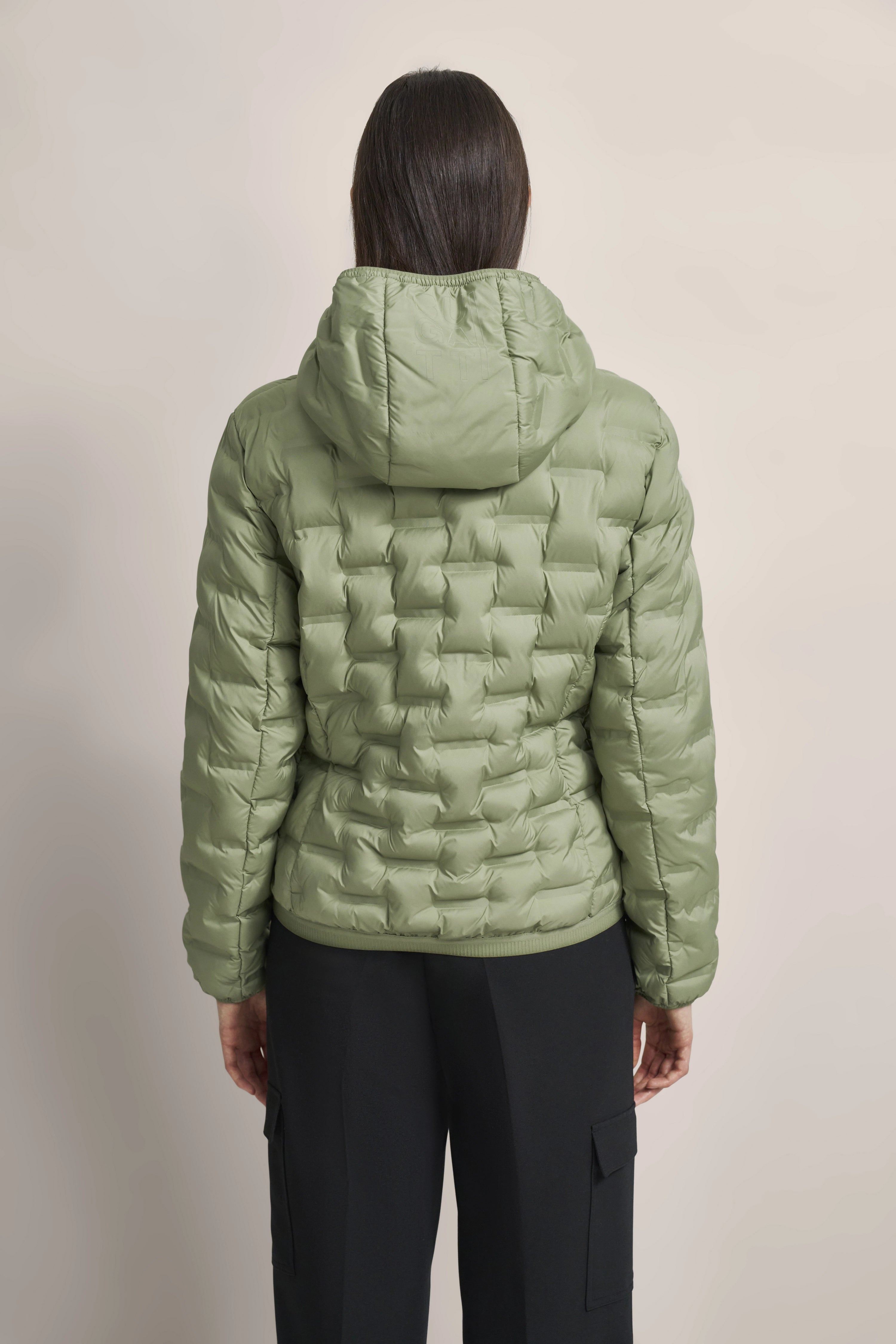 Green quilted jacket by bugatti, back view, casual model shot.