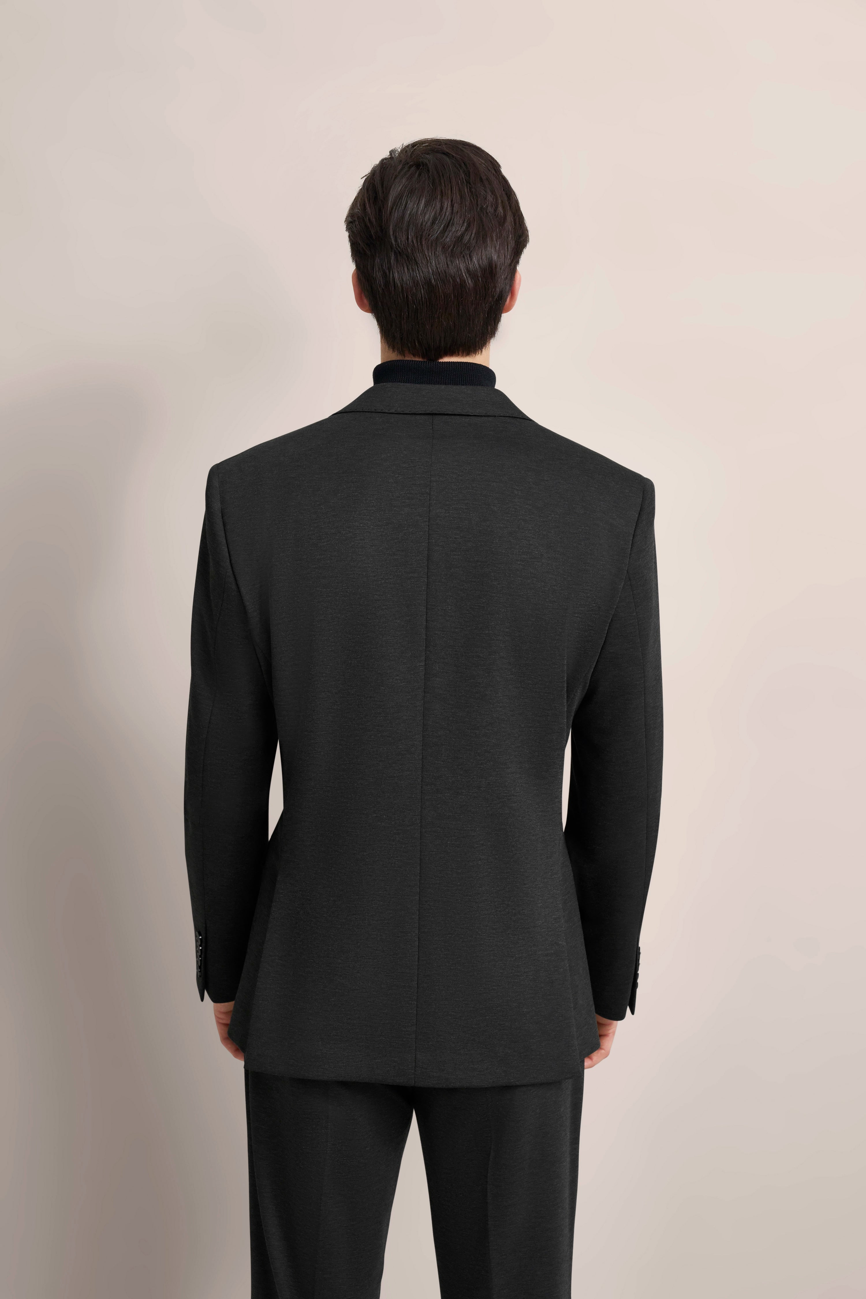 Black bugatti suit, rear view, model image, simple elegance and classic design.
