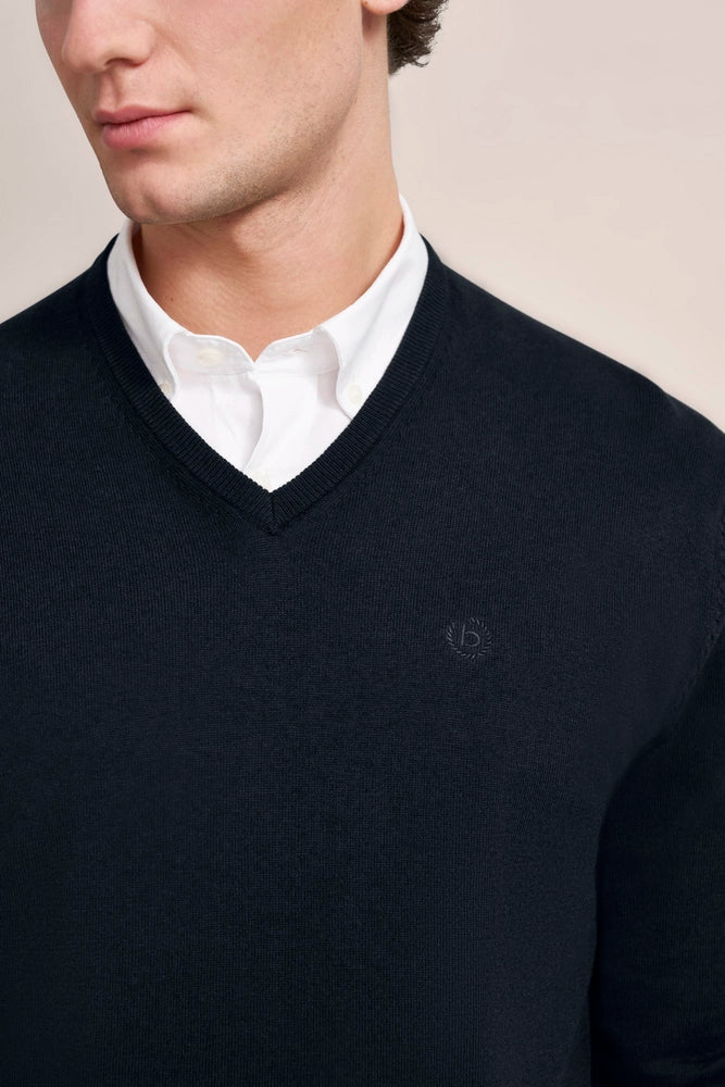 Black bugatti V-neck sweater over white shirt, bust view.