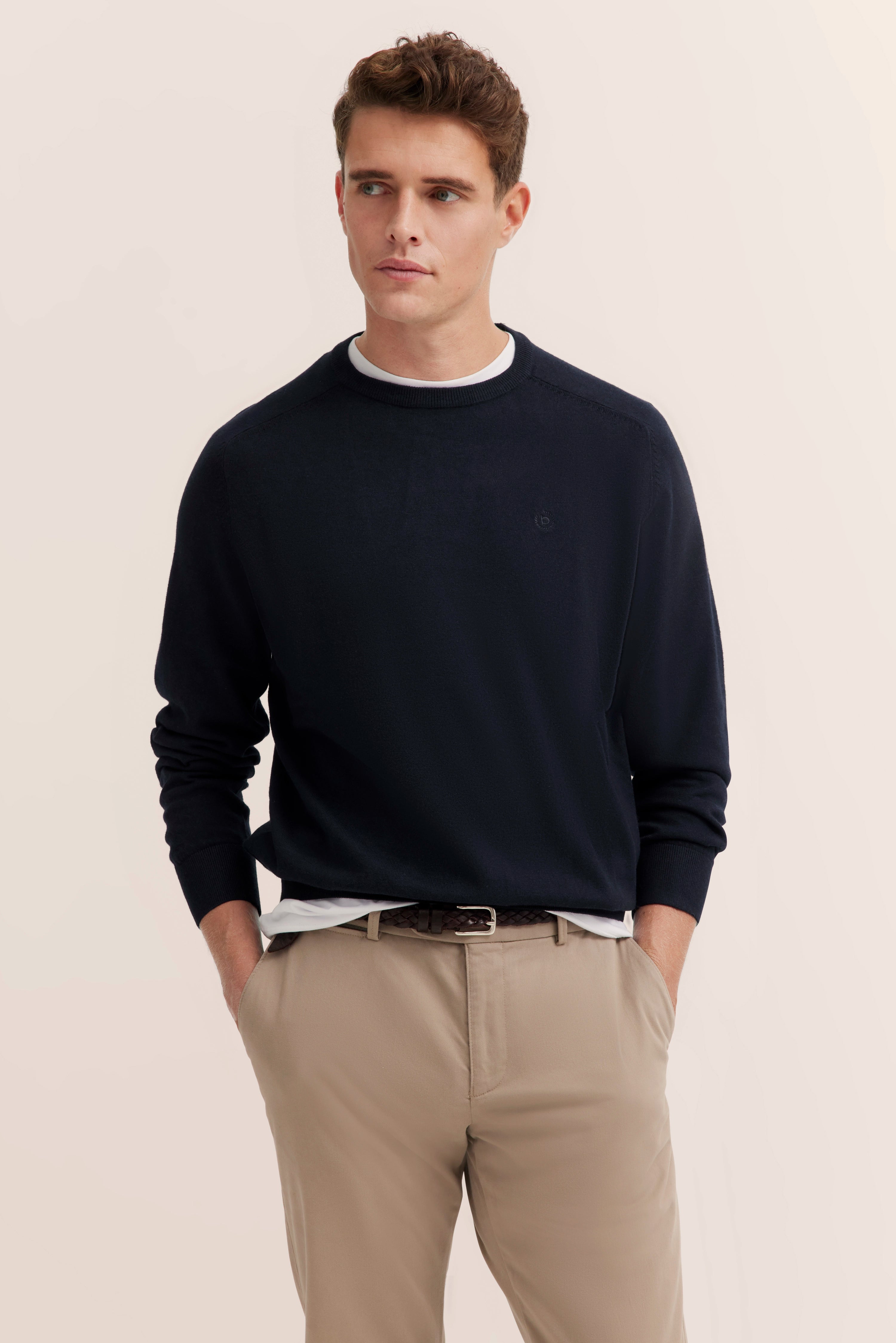 bugatti model image: navy sweater, beige chino, casual pose, elegant style.