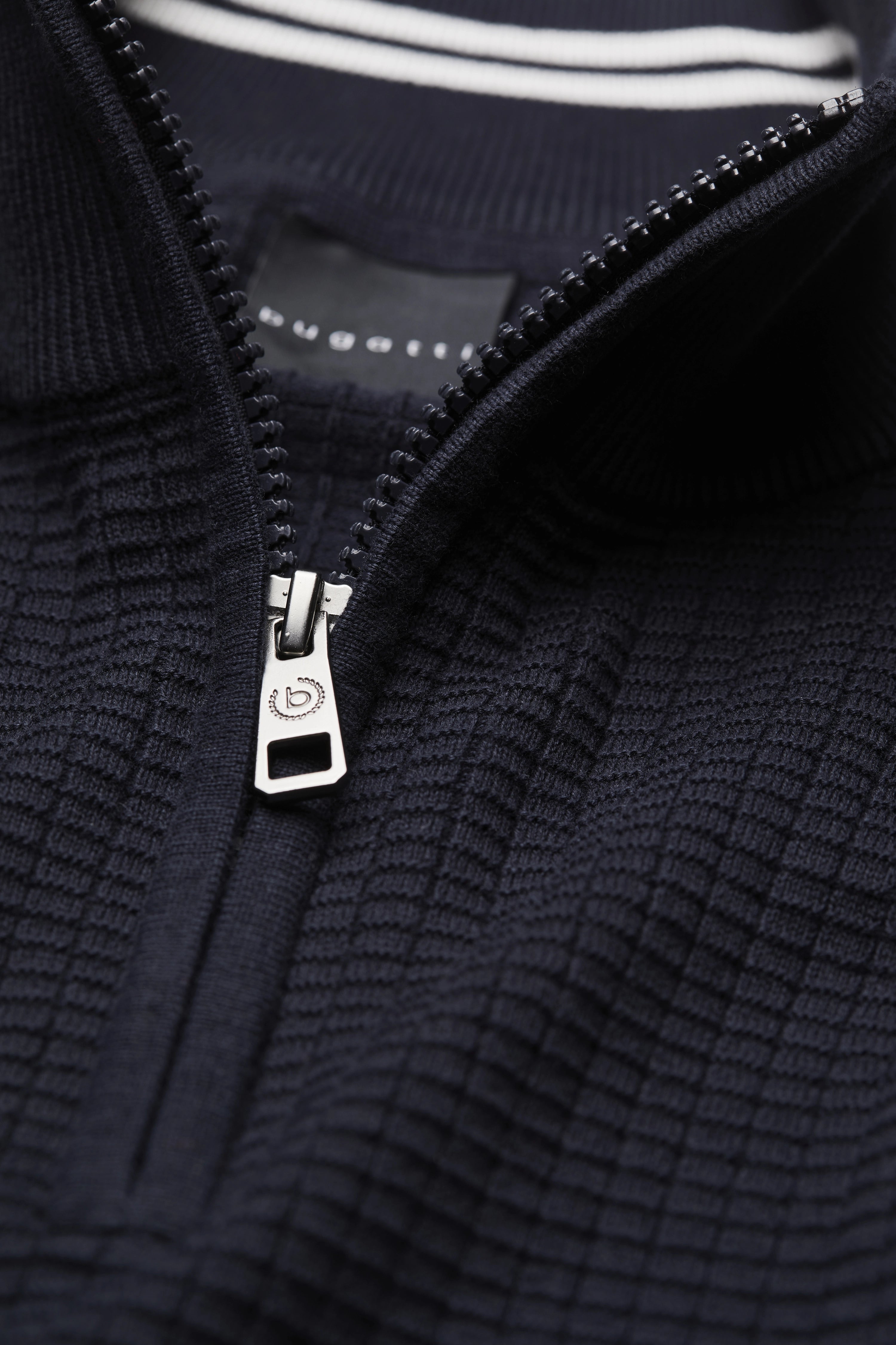 Navy zip-up sweater with textured pattern by bugatti, detail view.