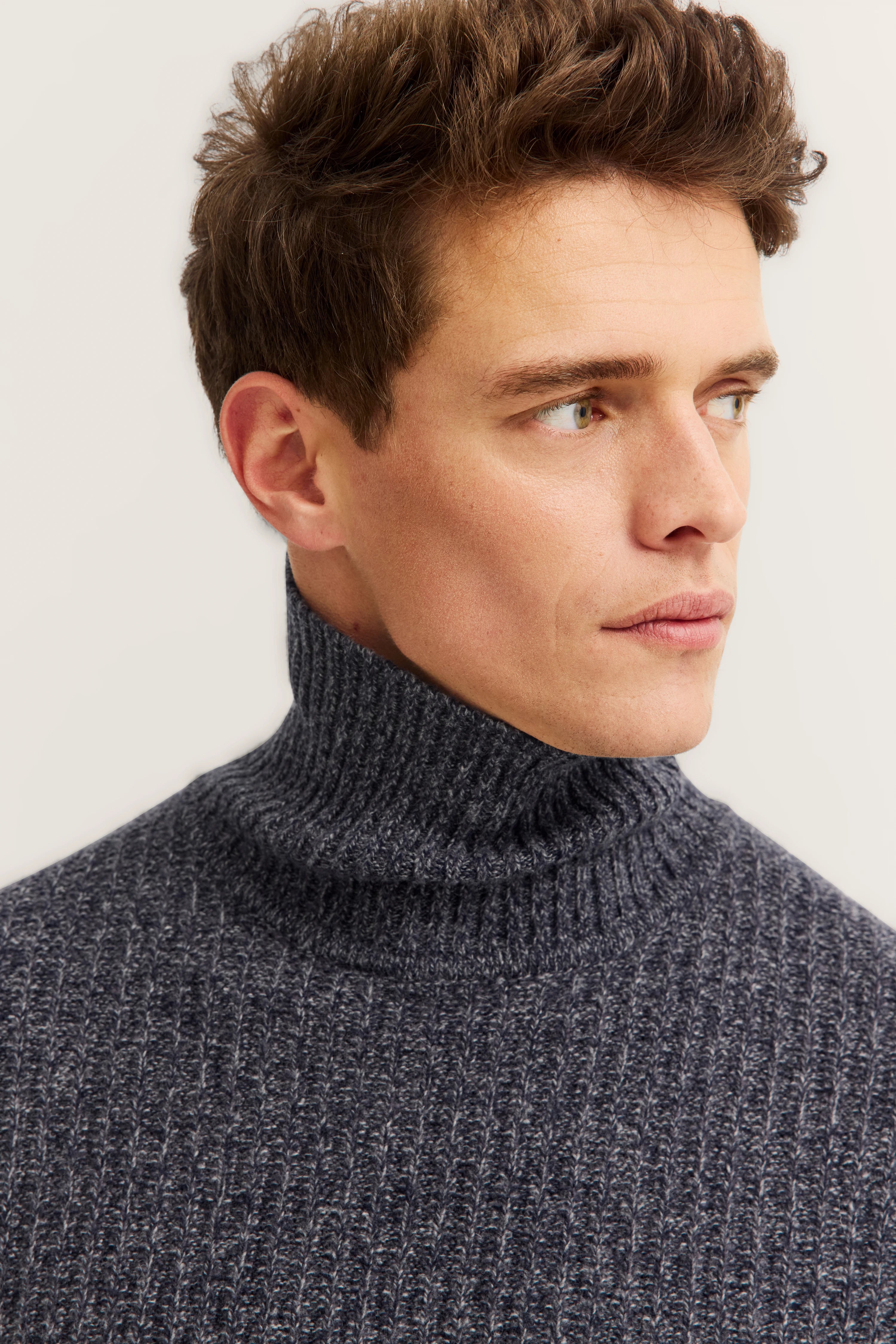 Gray turtleneck sweater by bugatti, bust portrait.