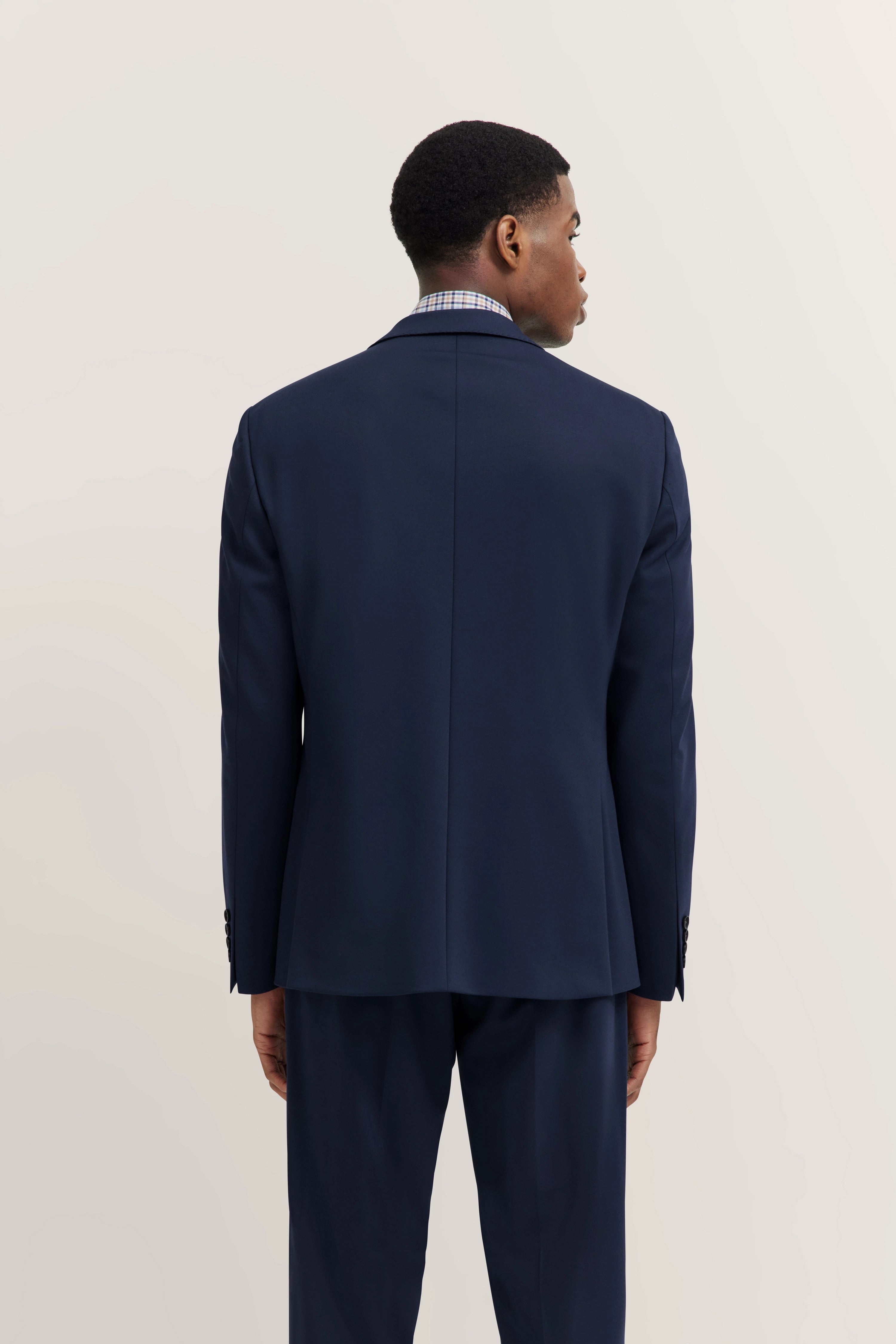 bugatti suit in dark blue, rear model view, casual and elegant, timeless design.