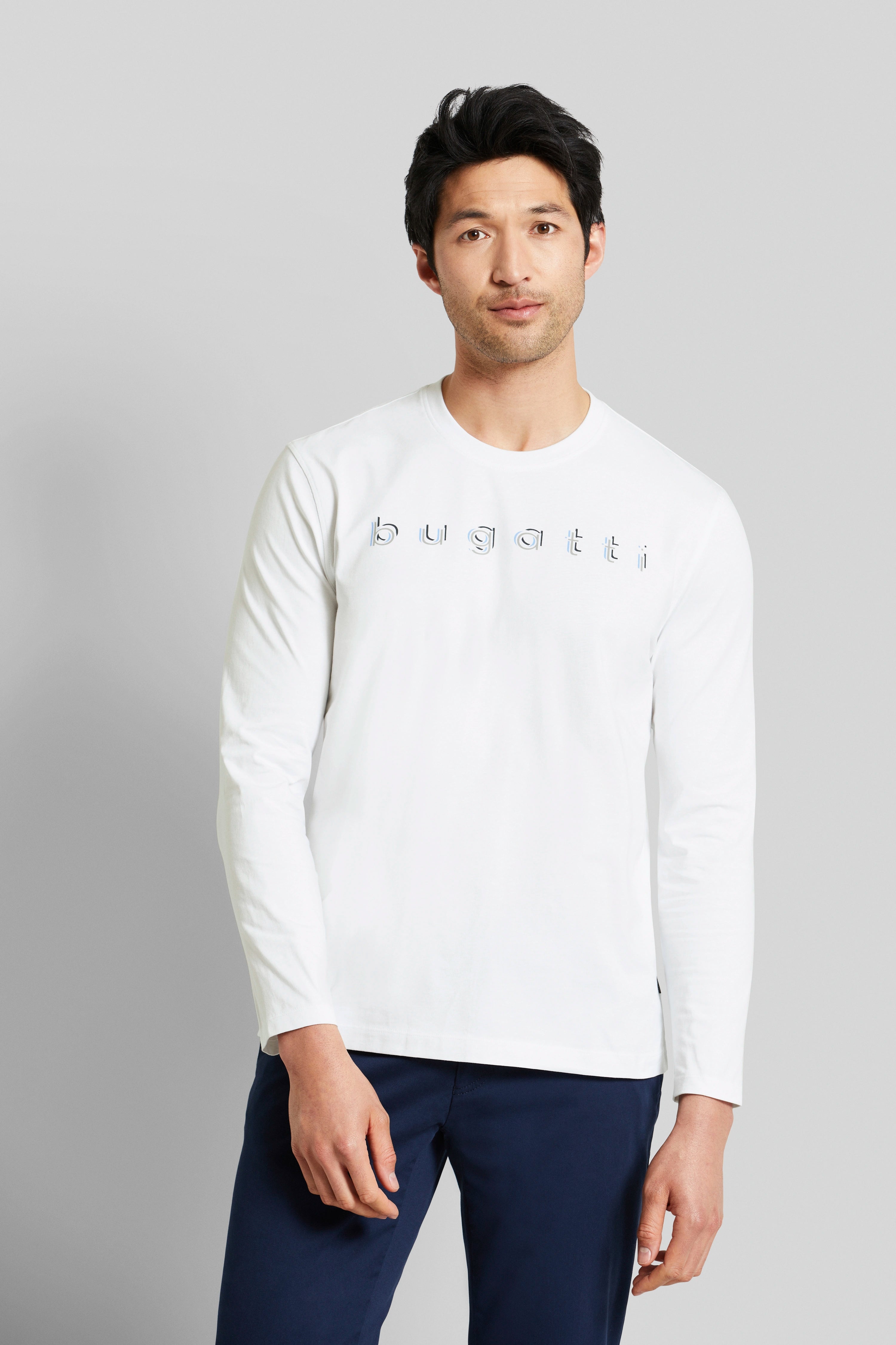 White bugatti long-sleeve shirt, model in relaxed pose.