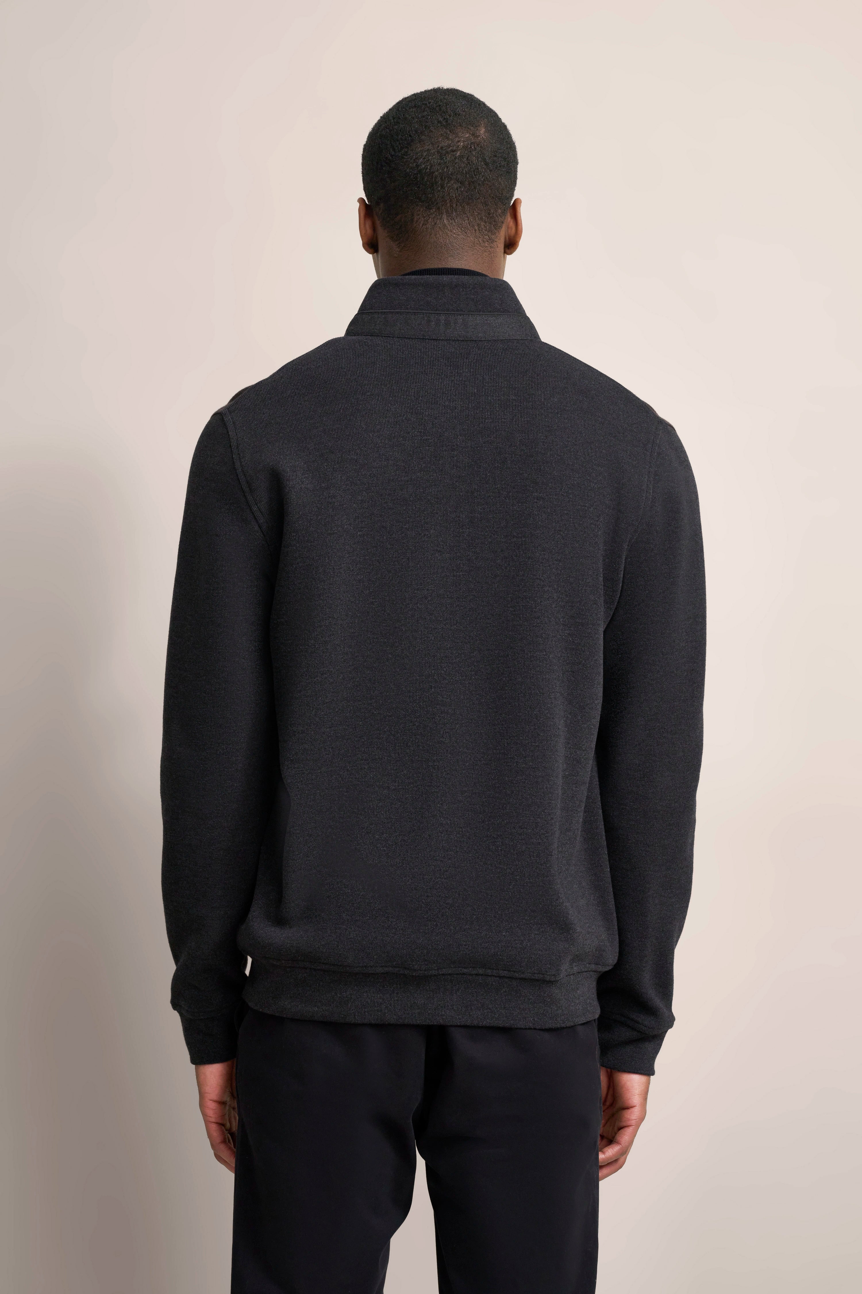 Black bugatti sweater, back view, casual model shot.