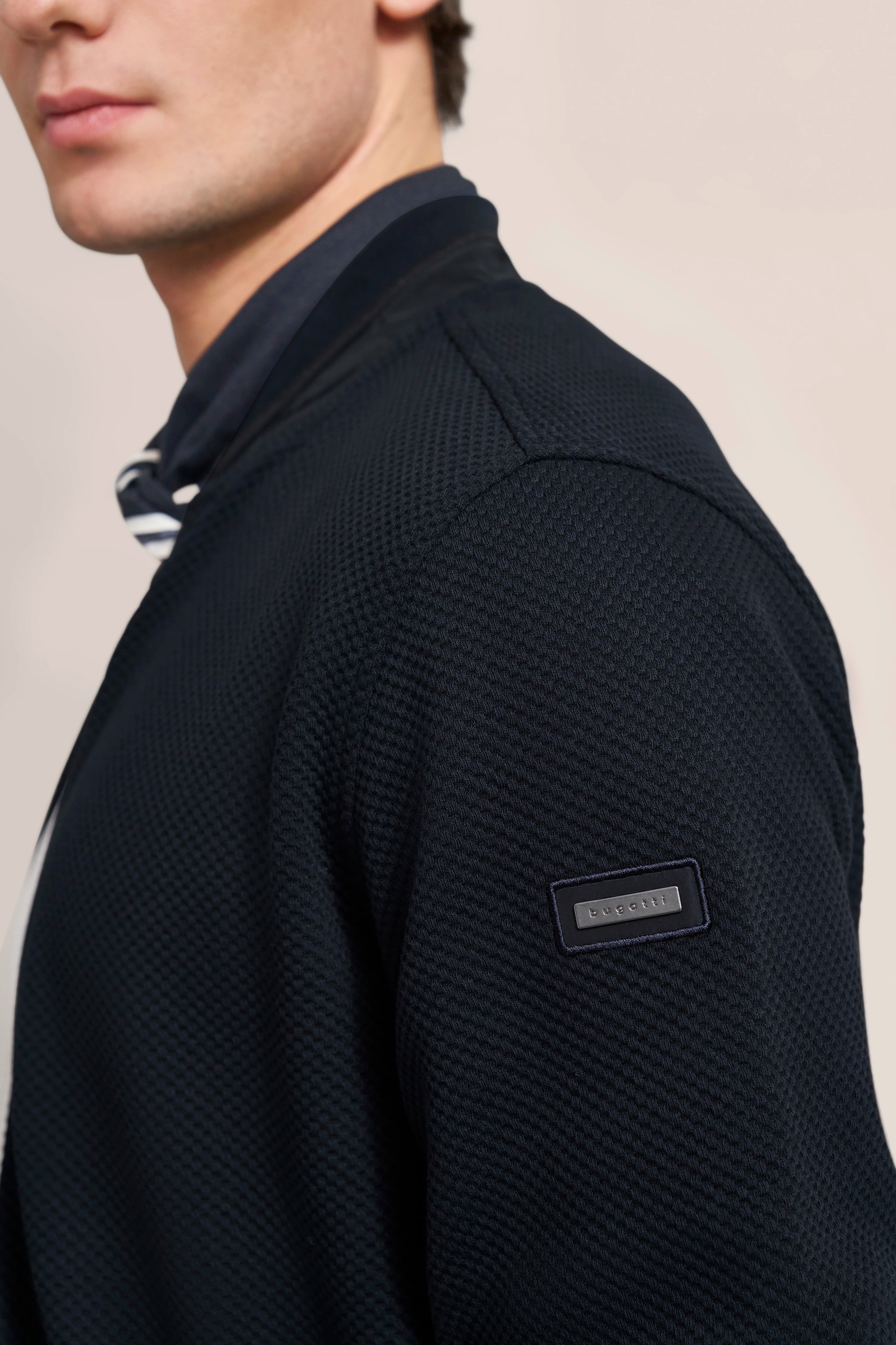 Navy bugatti cardigan, bust view, stylish and elegant.