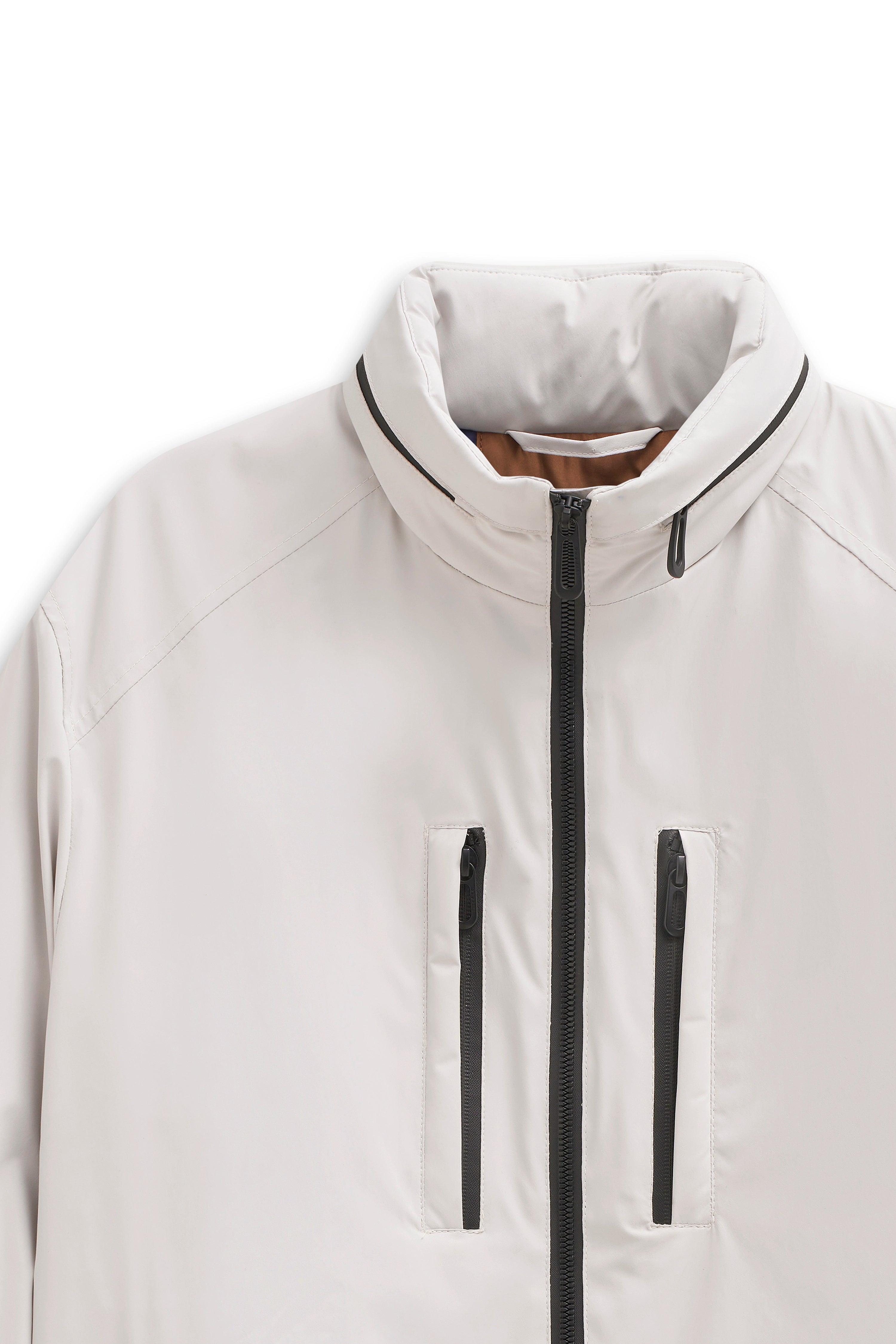 White bugatti jacket with stand-up collar, black zipper, and chest pockets. Bust shot.