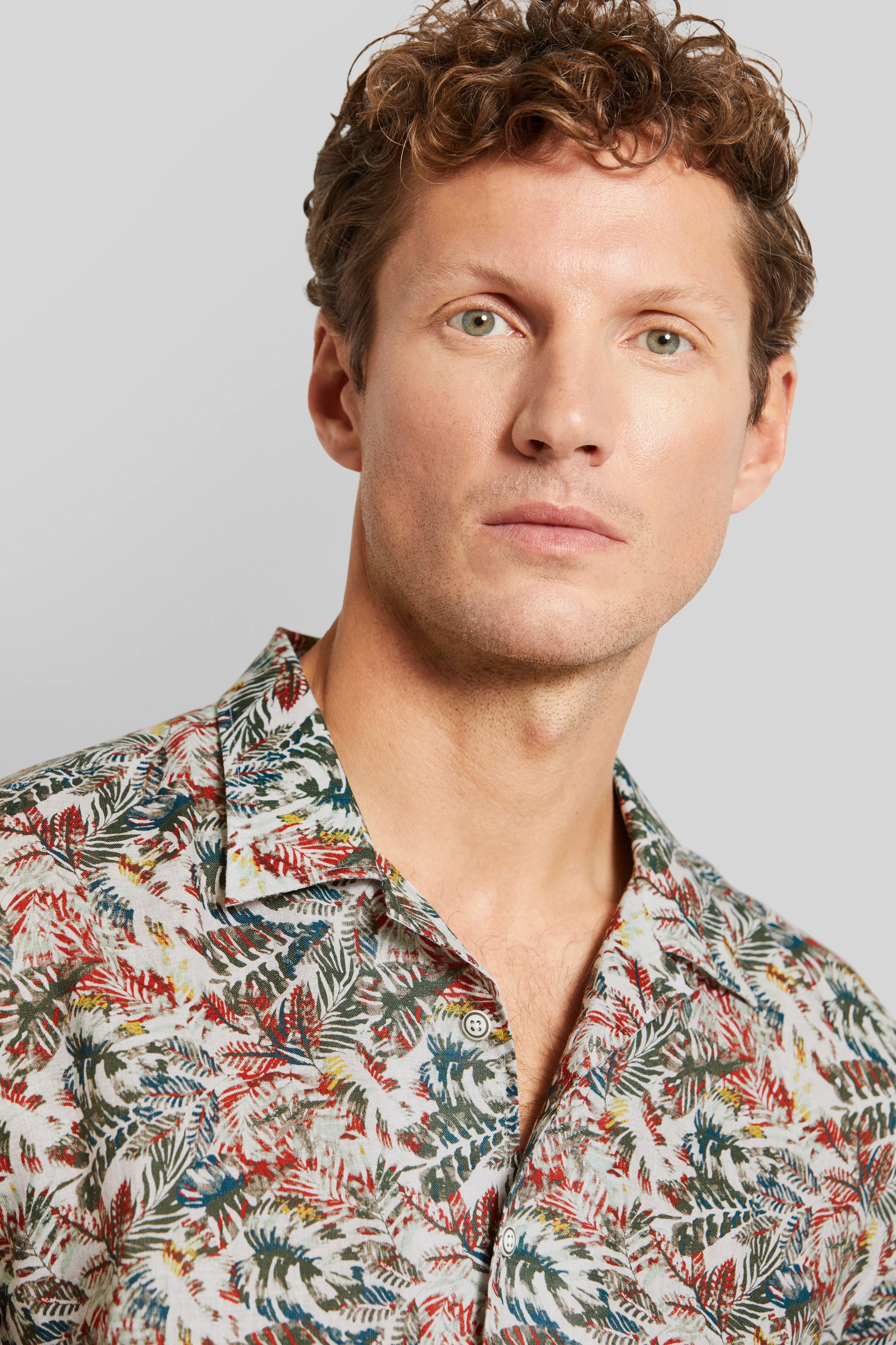 Colorful bugatti shirt with leaf pattern, model image, man looking forward.