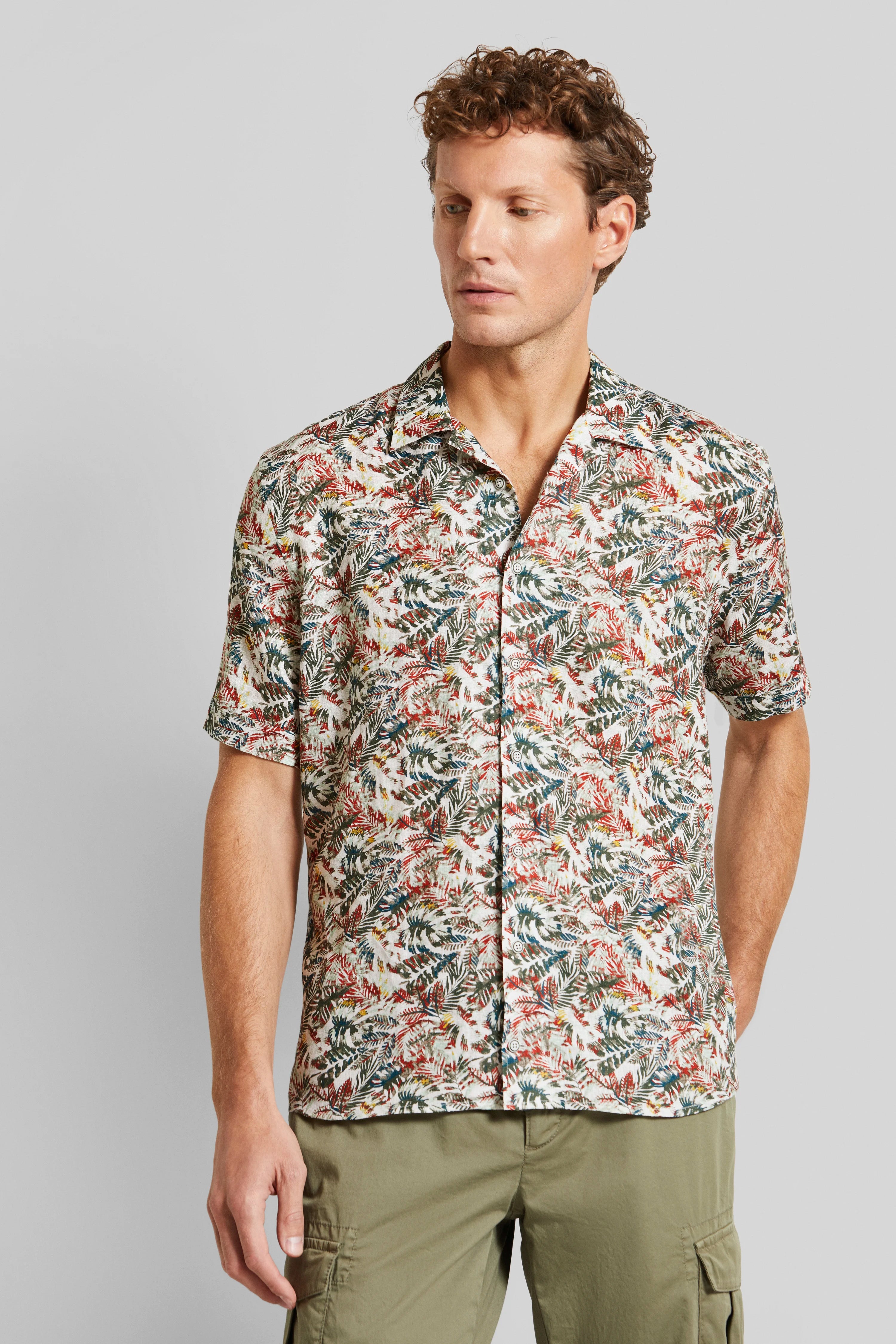 bugatti shirt with red-green floral pattern, model in relaxed pose.