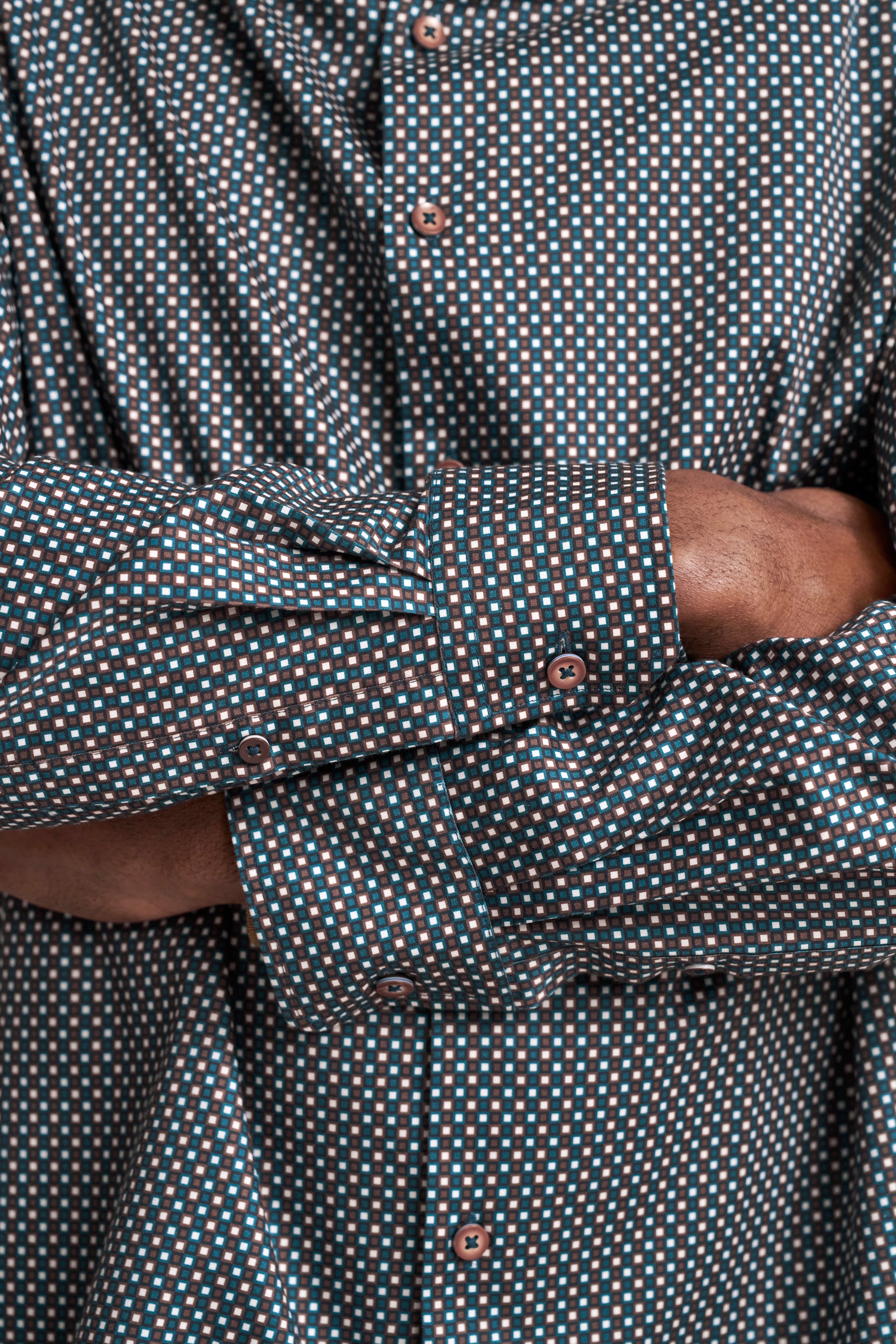 Close-up of a bugatti shirt with a blue-brown check pattern.