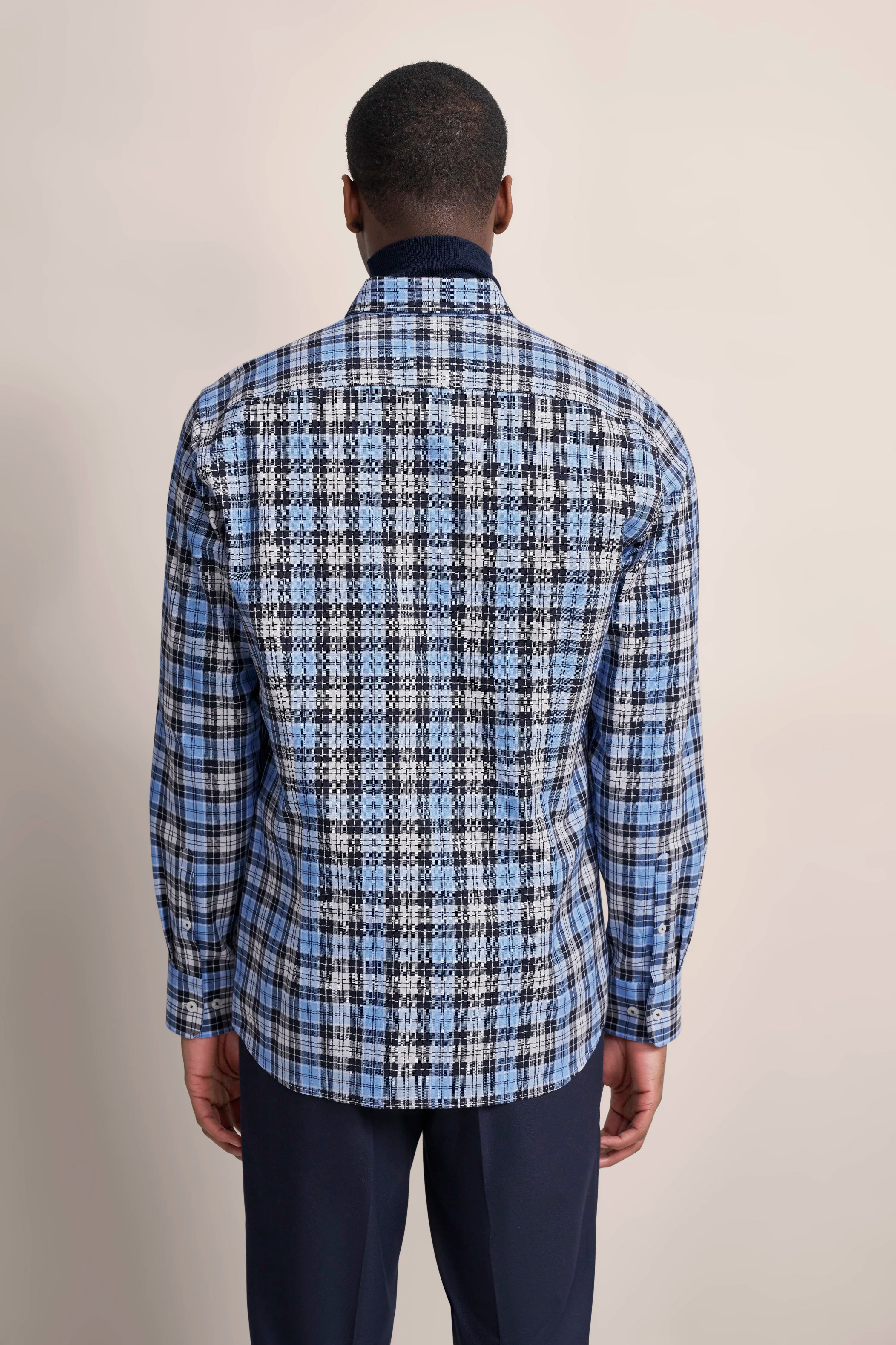 bugatti blue checkered shirt, back view, casually worn with dark pants.