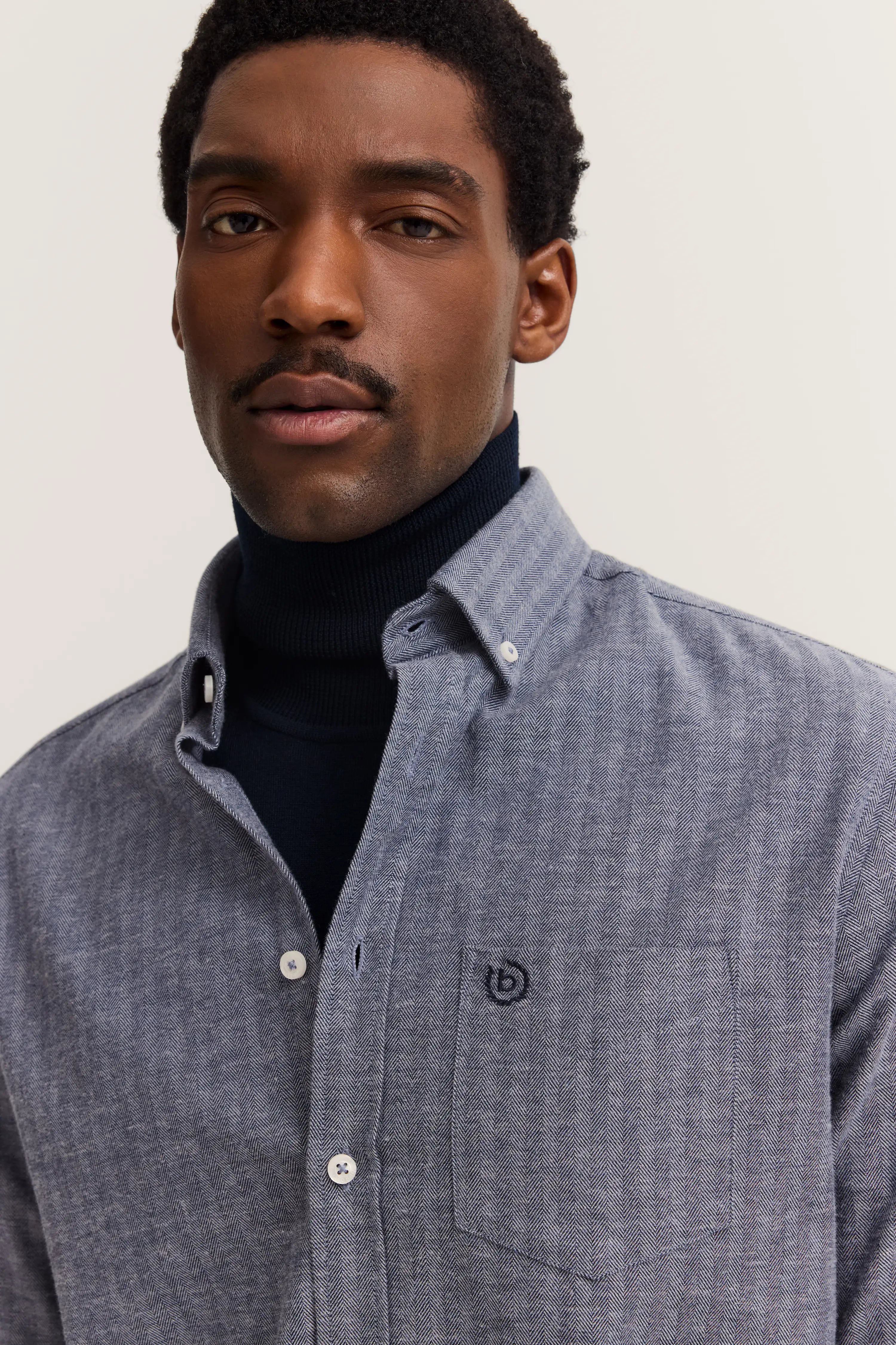 Gray bugatti shirt, back view, fine stripe pattern, white buttons, casually styled.