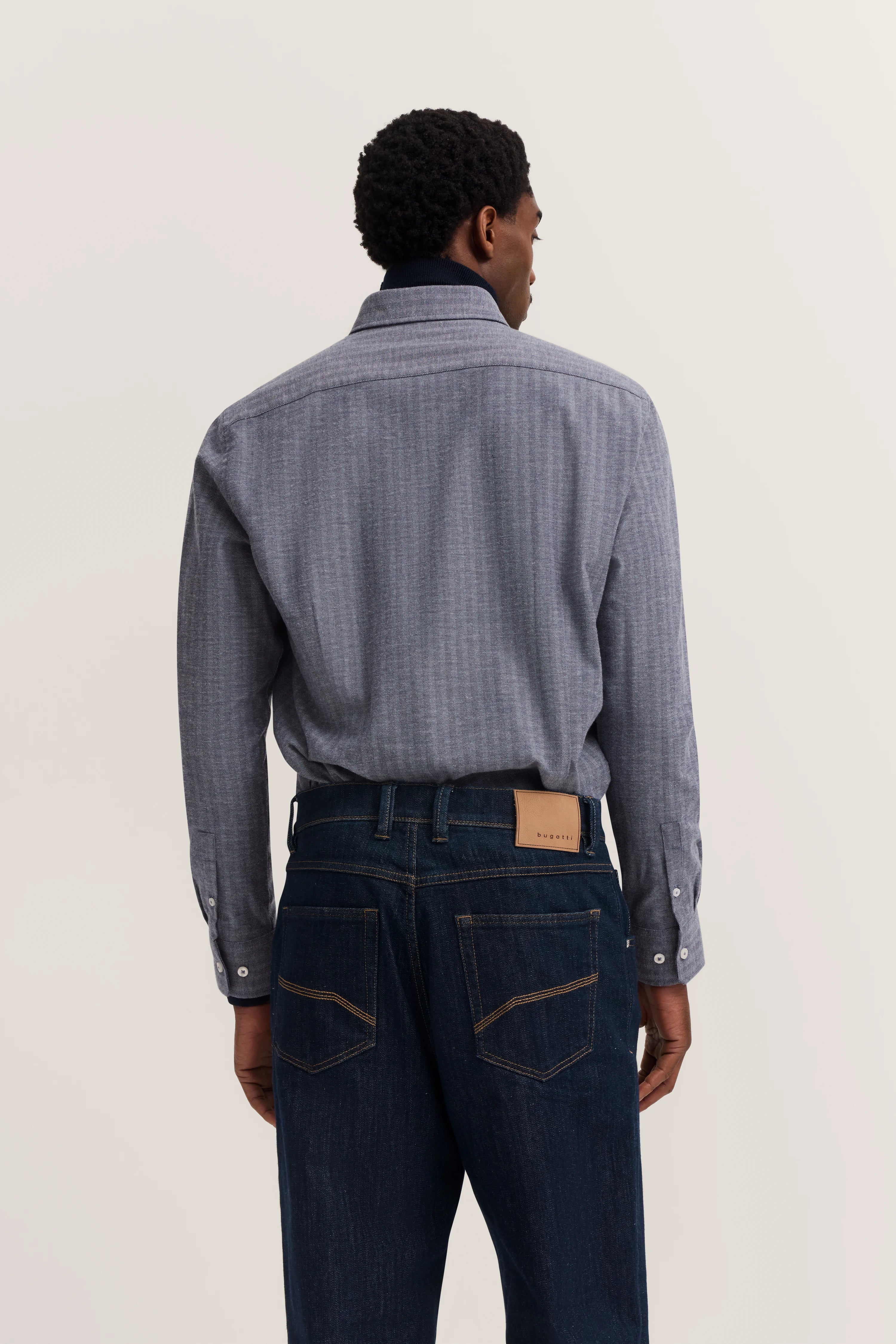 Model looks to the side.