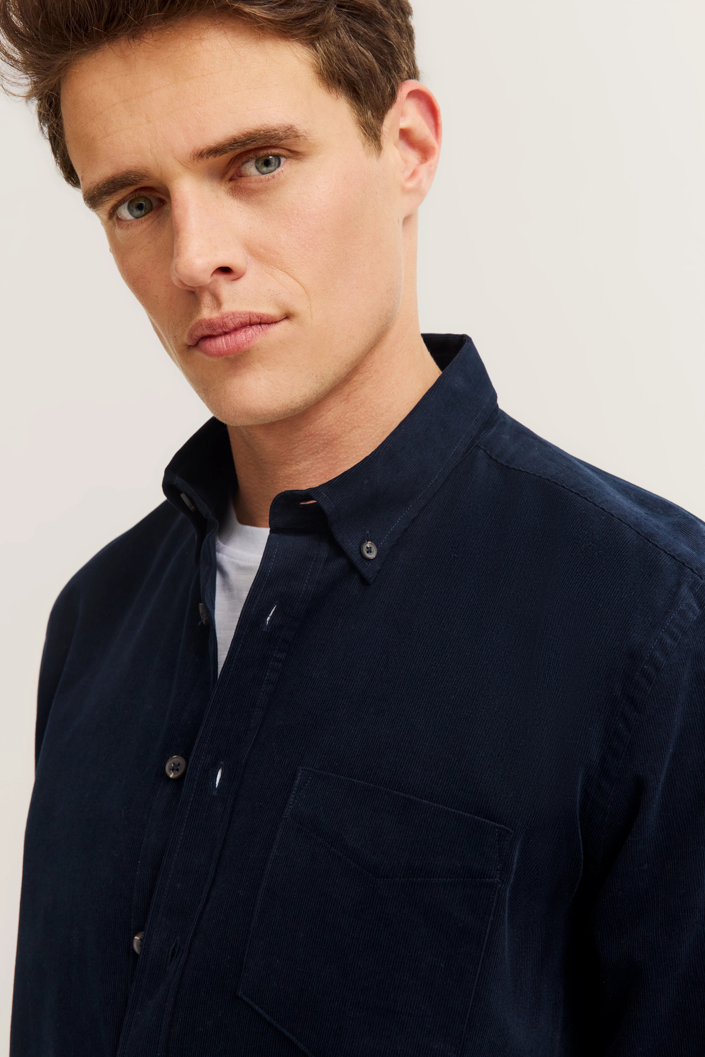 bugatti shirt in dark blue, model posing casually, stylish and timeless.