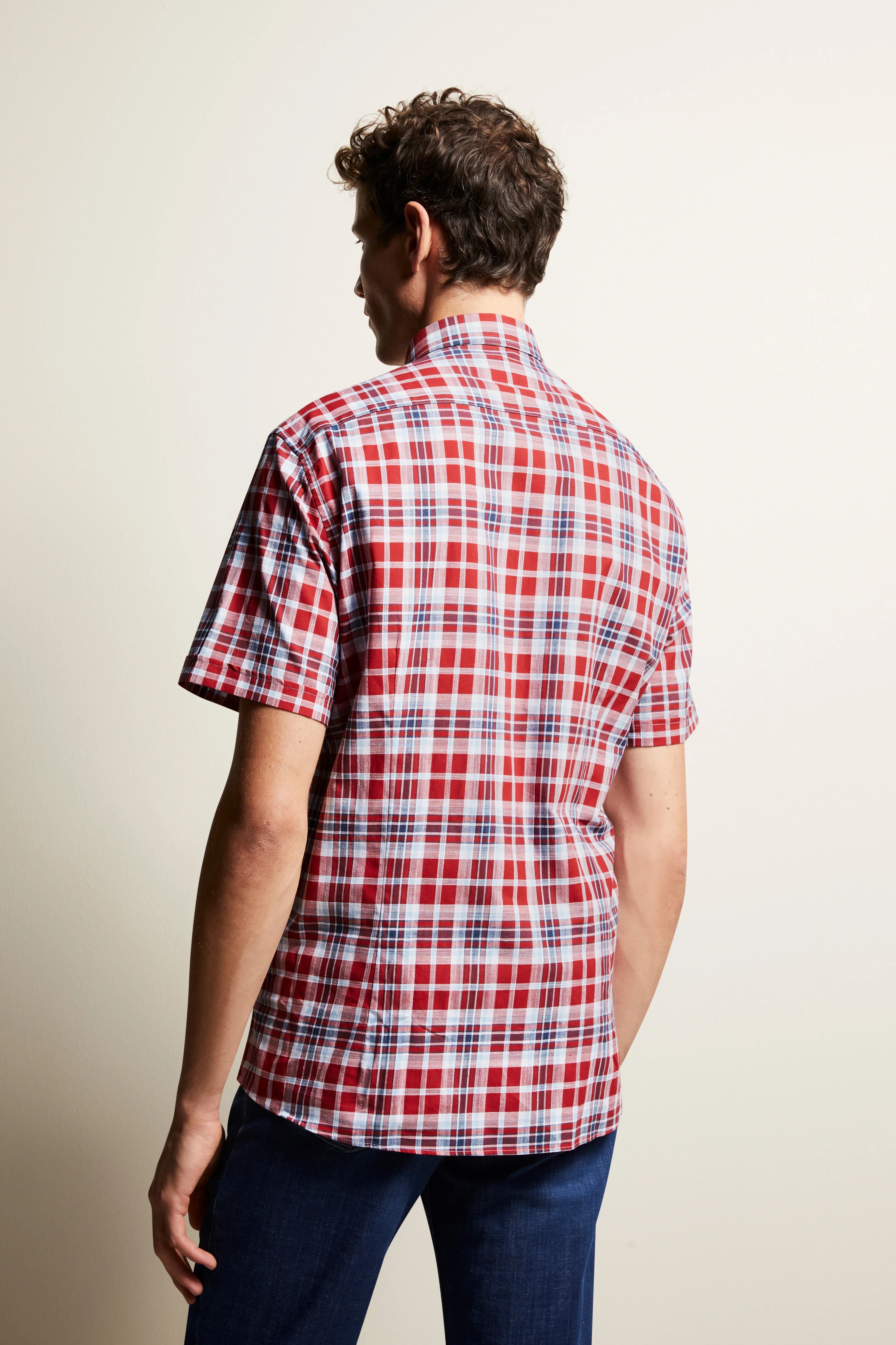 bugatti red checked shirt, back view, casual look, paired with blue jeans.