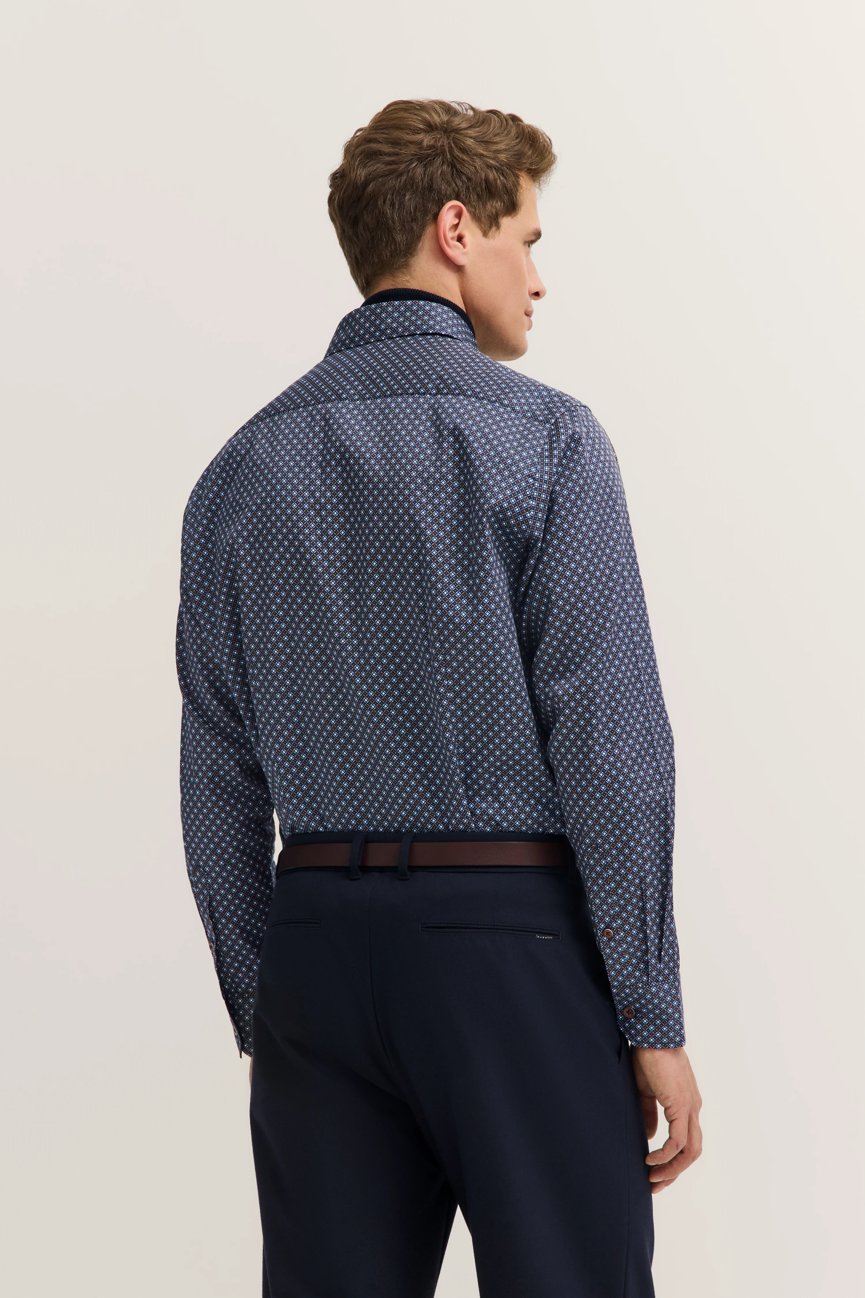 Sweater draped over shoulders, exuding bugatti's refined style and Italian-inspired elegance.