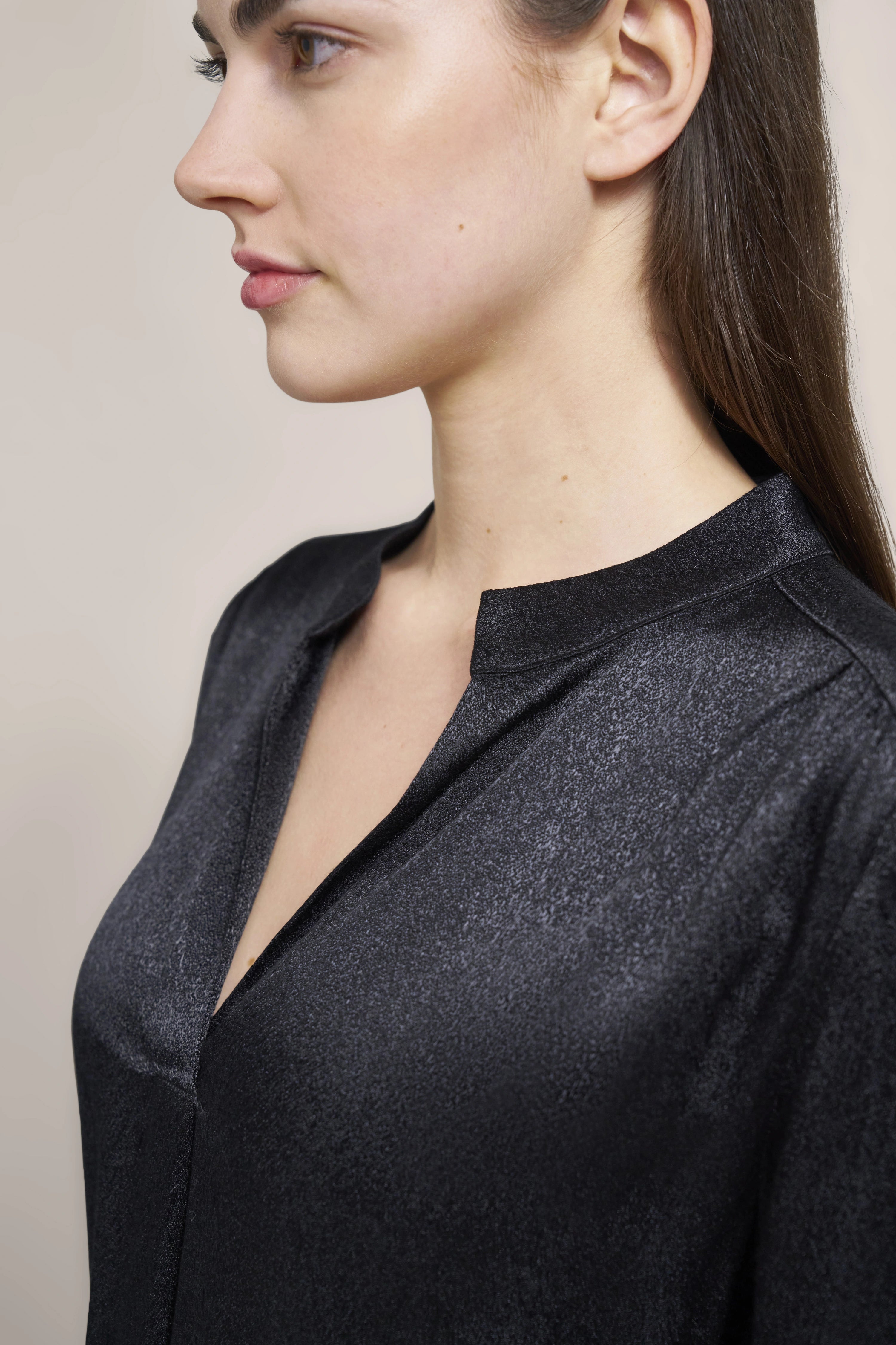 Black bugatti top, shiny, bust view, elegant style.