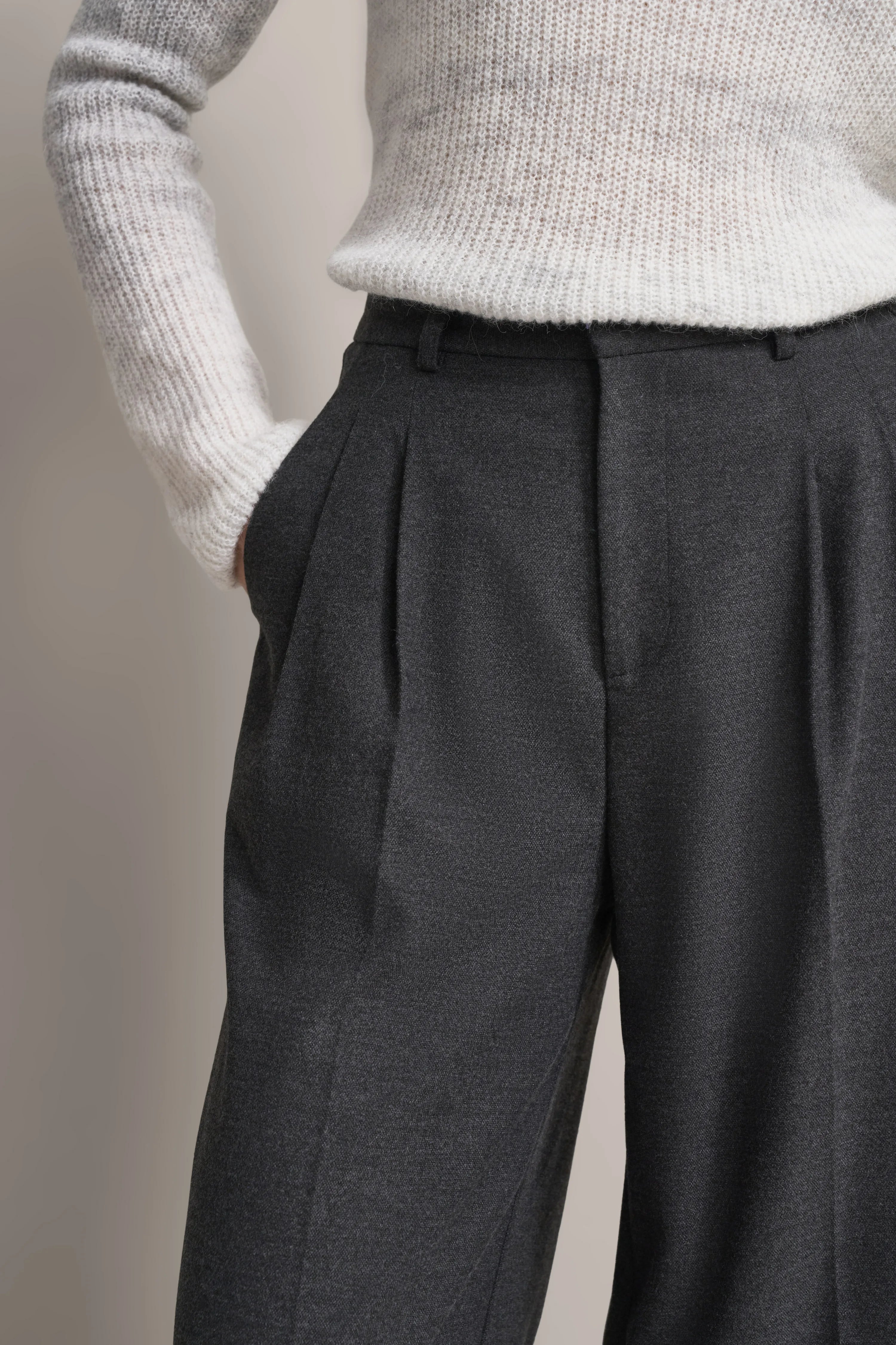 Gray suit pants with white knit sweater, casual bust shot, timeless elegance by bugatti.