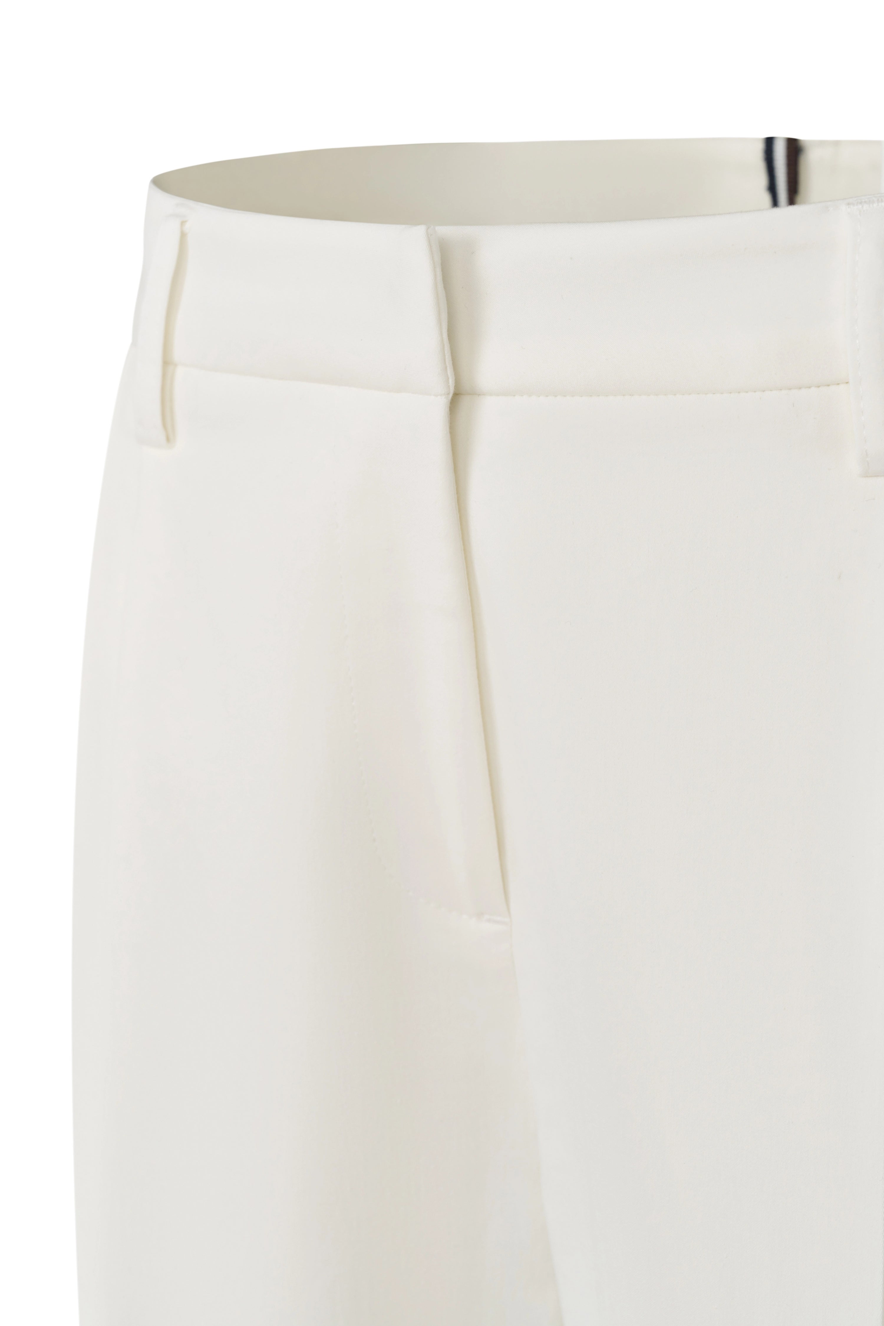 White bugatti pantsuit with brown belt, casual bust view.