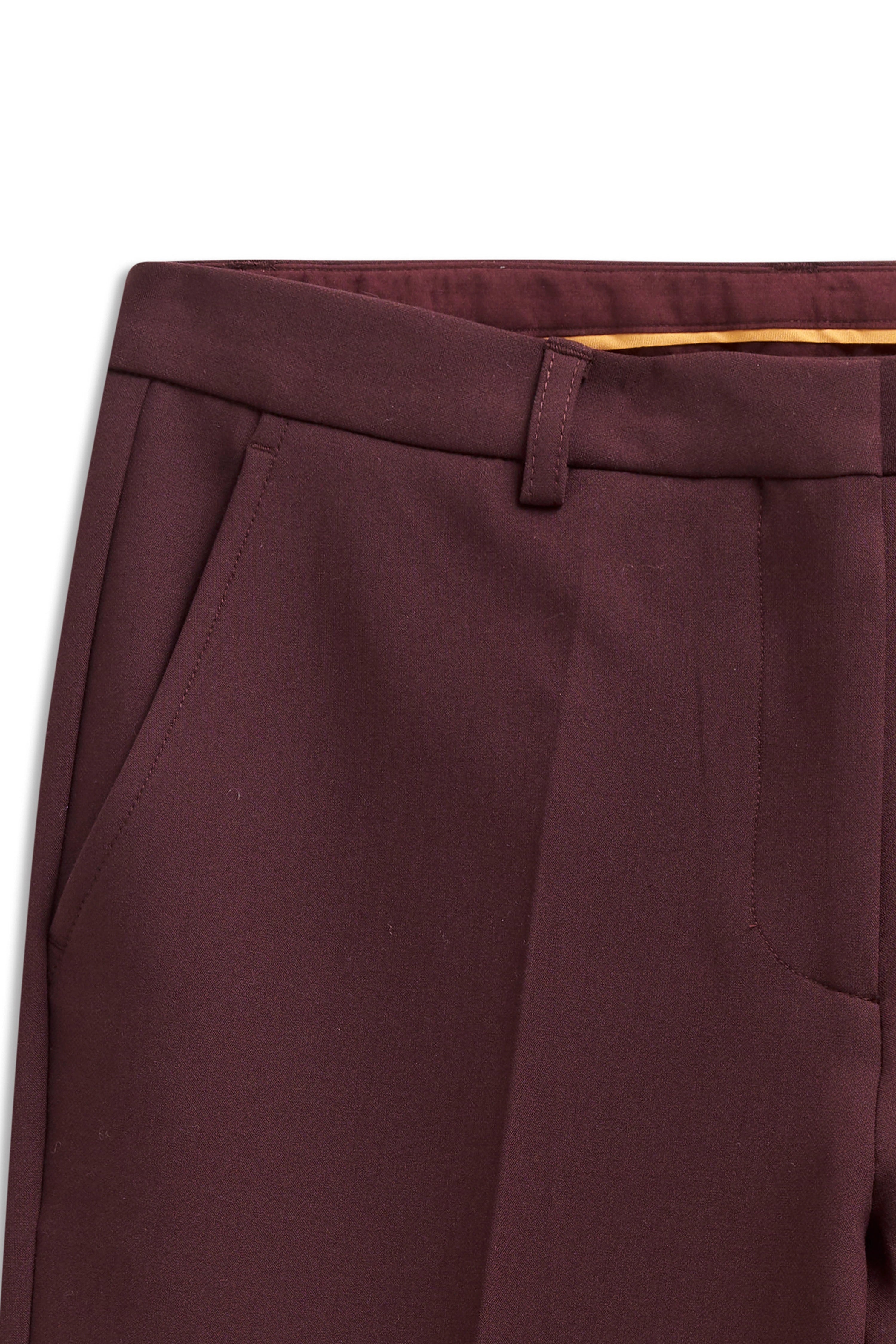 Wine-red bugatti trousers, detail view, visible pockets and waistband.