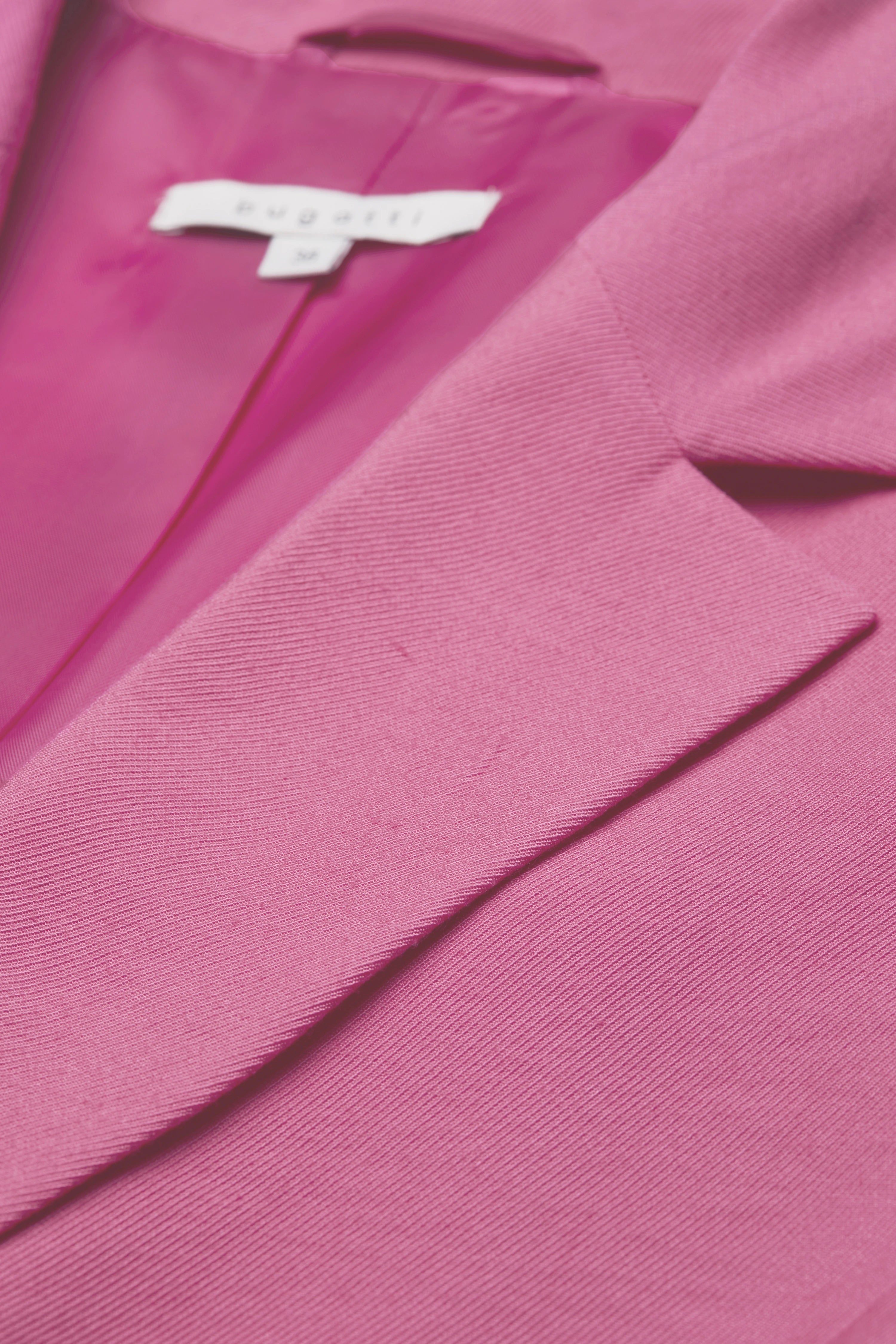 bugatti pink blazer, fabric close-up, bust view, elegant and refined style.