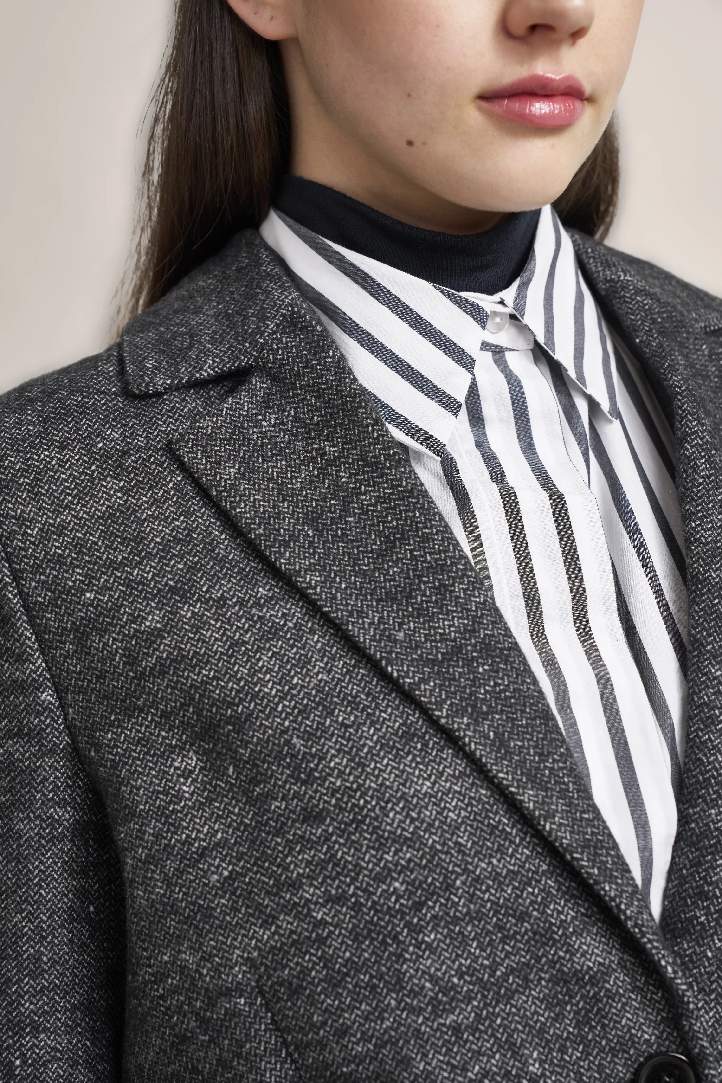 Gray tweed blazer over black-and-white striped blouse, close-up, no poses, bugatti style.