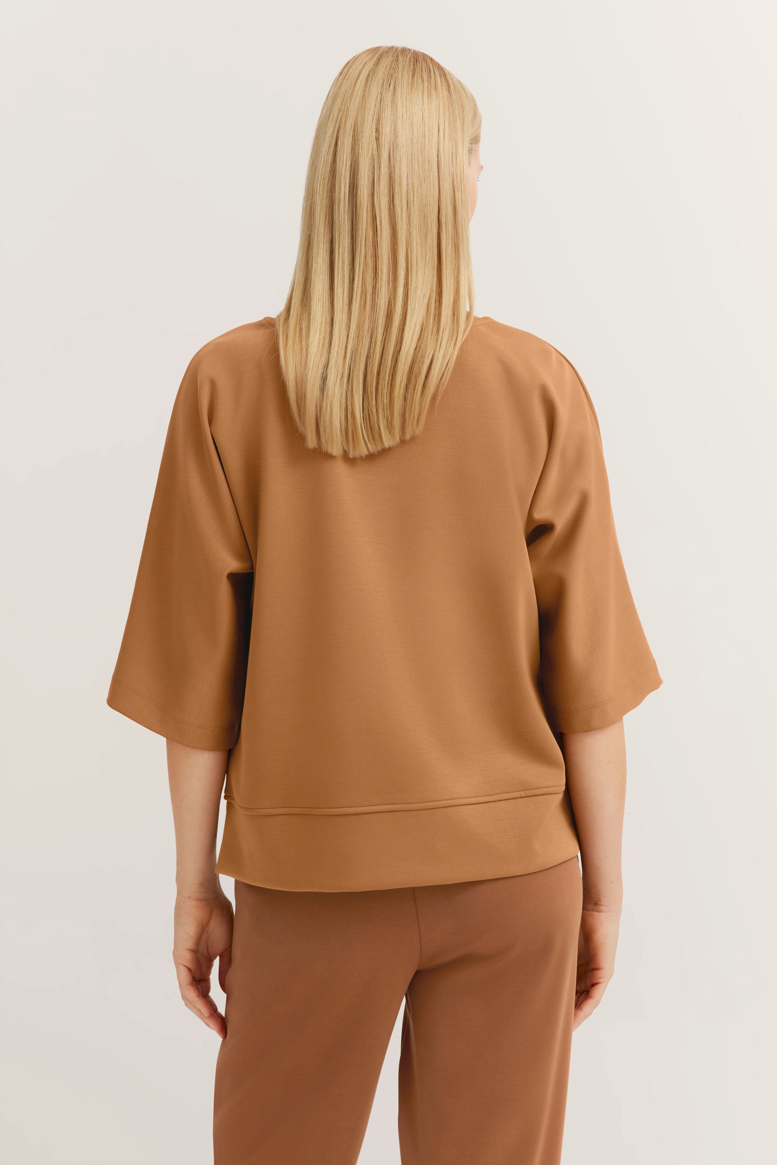 Beige bugatti suit, rear view, casual design, relaxed look.