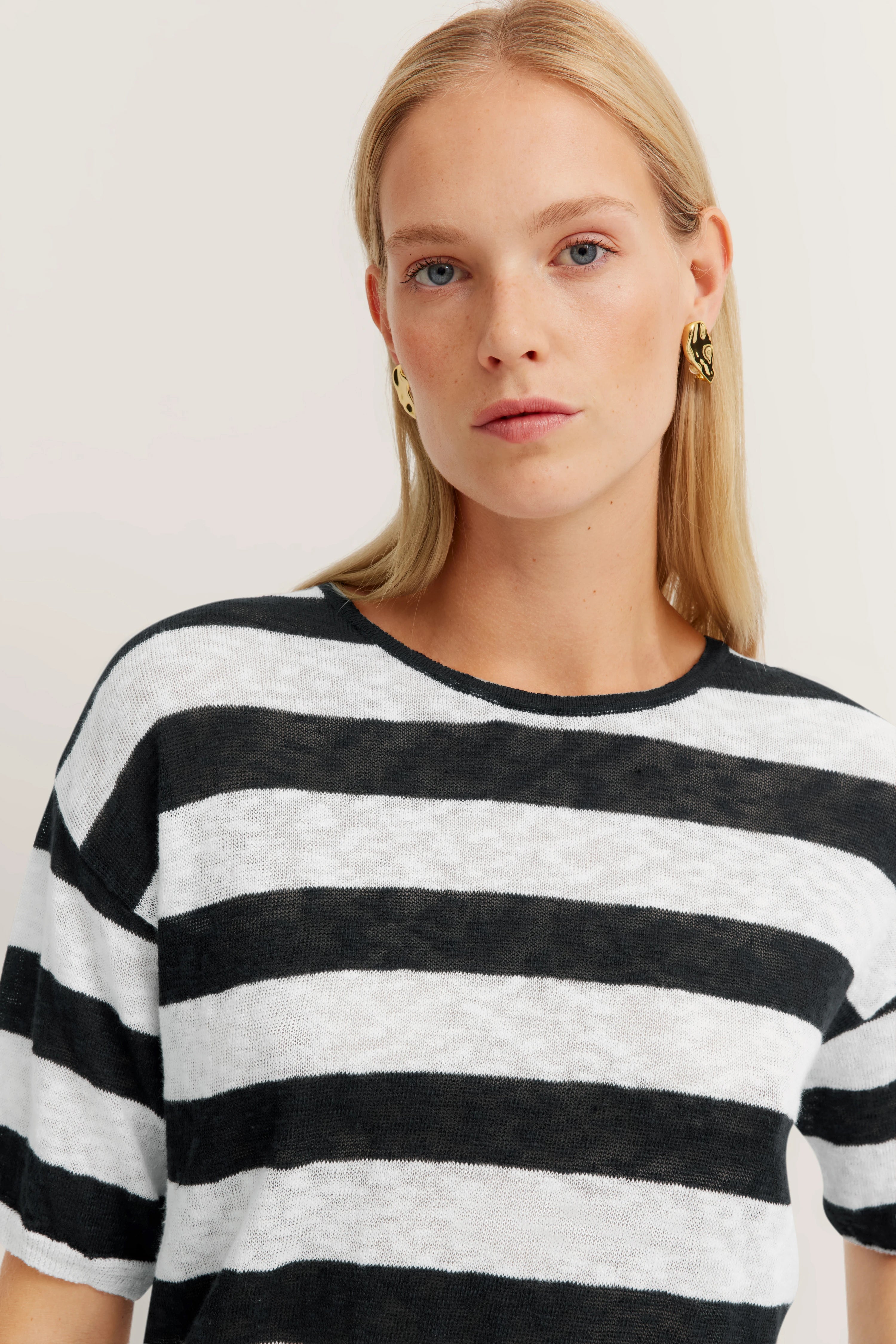 Black-and-white striped shirt, bust image, elegant look, bugatti style.