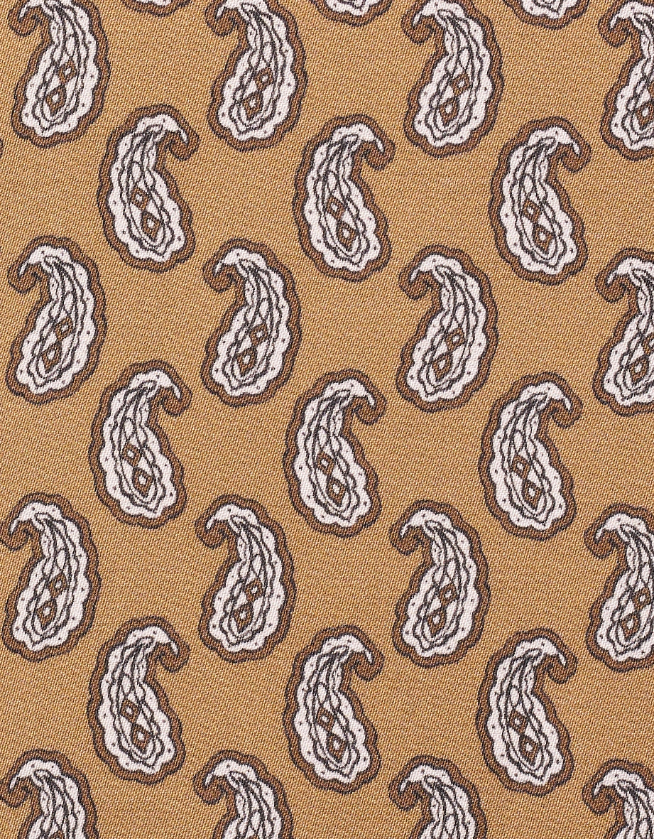 Paisley-Muster in Braun und Weiß auf beigefarbenem Stoff, Detailansicht.