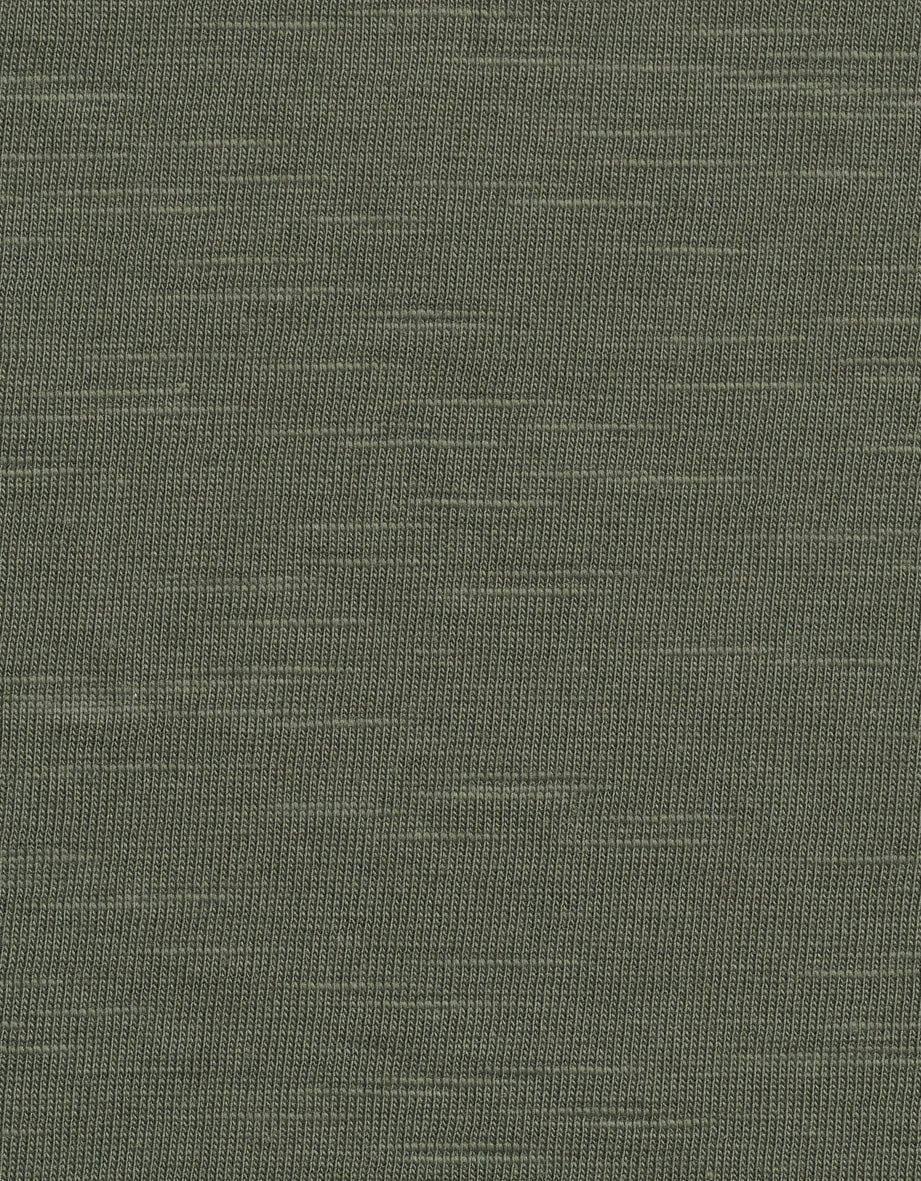 Groen breiwerk in close-up, textuurdetail voor bugatti mode.