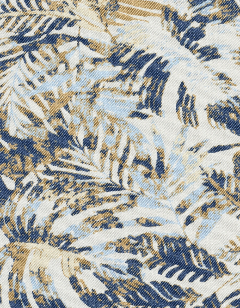 Tropisches Muster in Blau, Beige und Weiß auf Stoff.