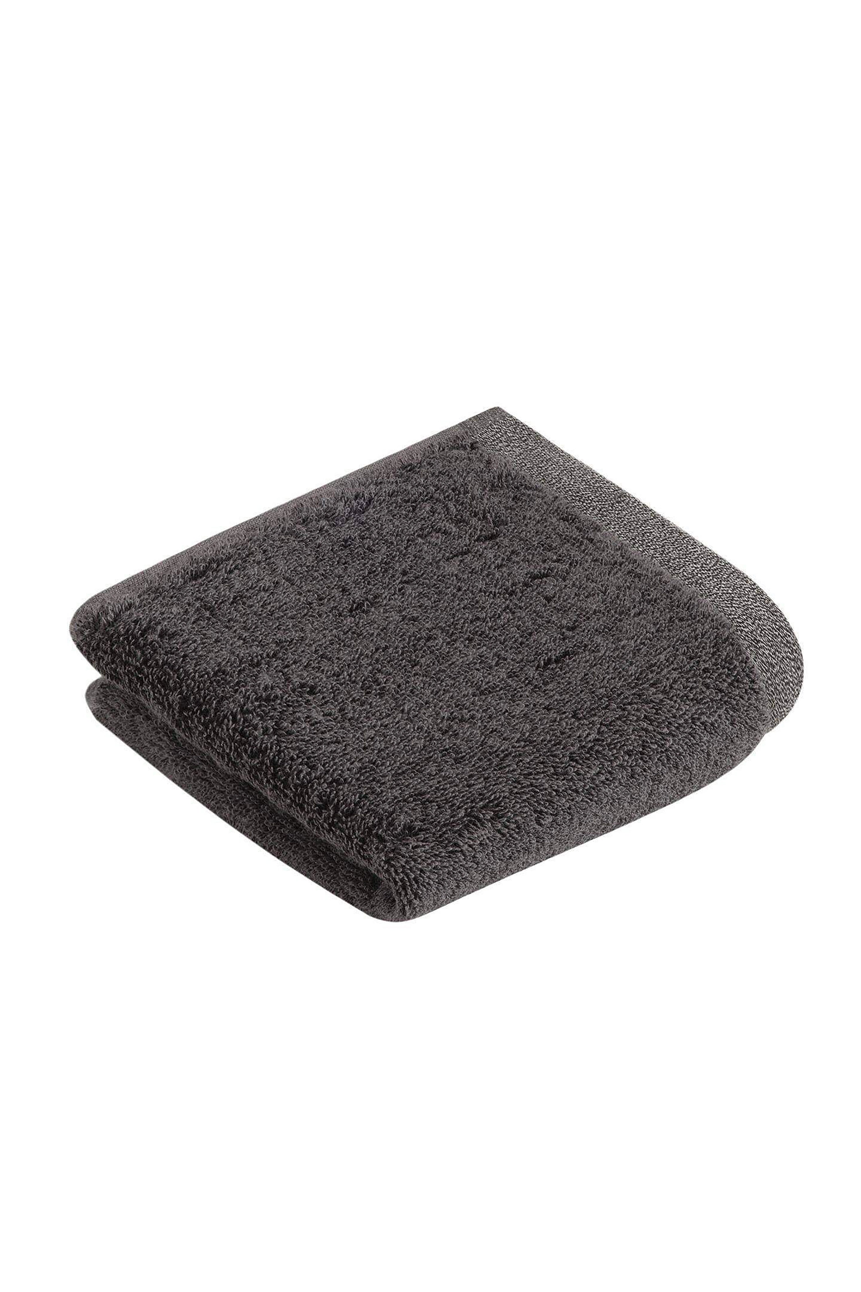Dunkelgraues, gefaltetes Handtuch aus weichem Material, schlichtes Design.