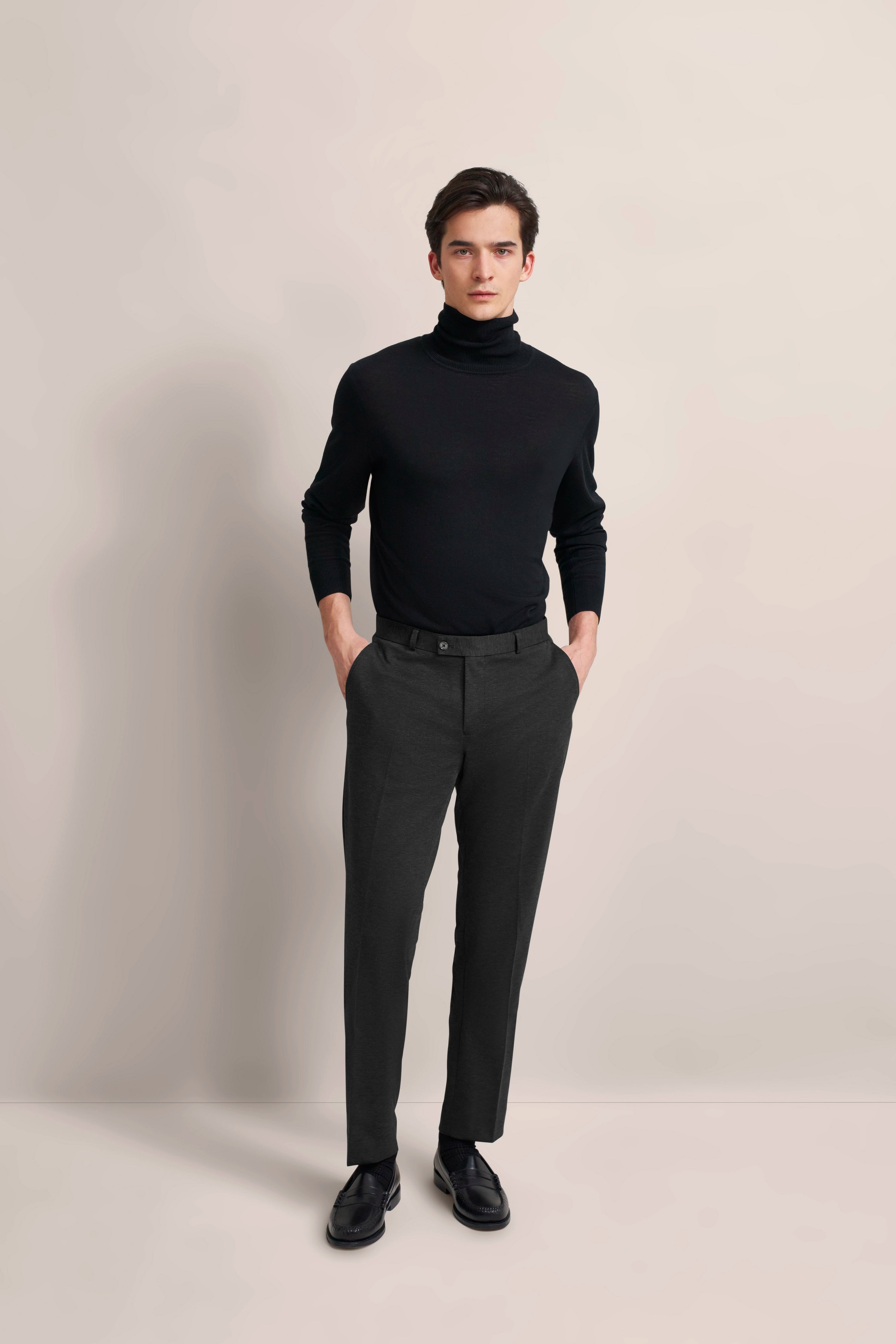 Black bugatti trousers, back view, casual model shot, classic elegance, timeless style.
