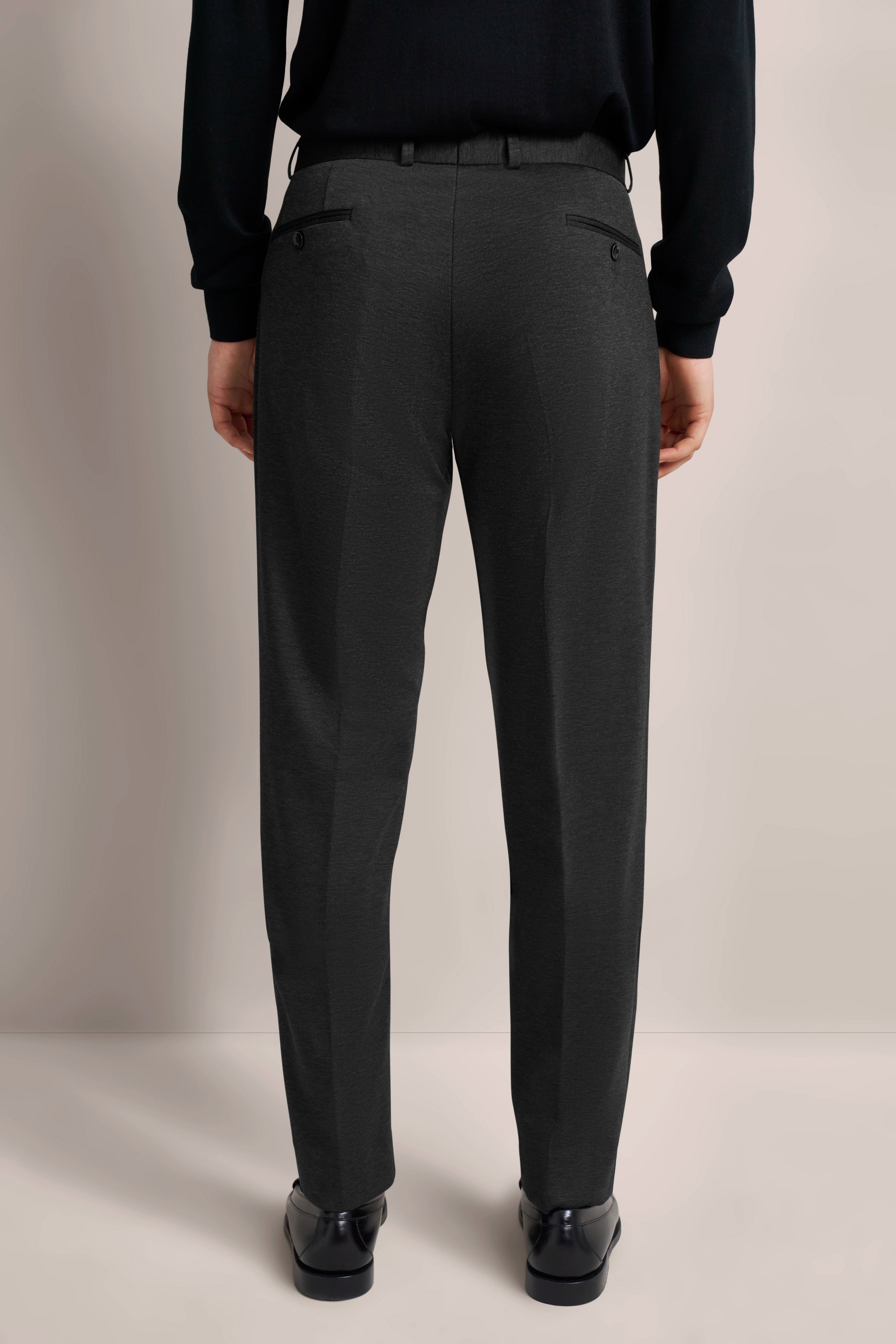 Model image, hands in pockets, exuding bugatti's Italian-inspired elegance and timeless style.