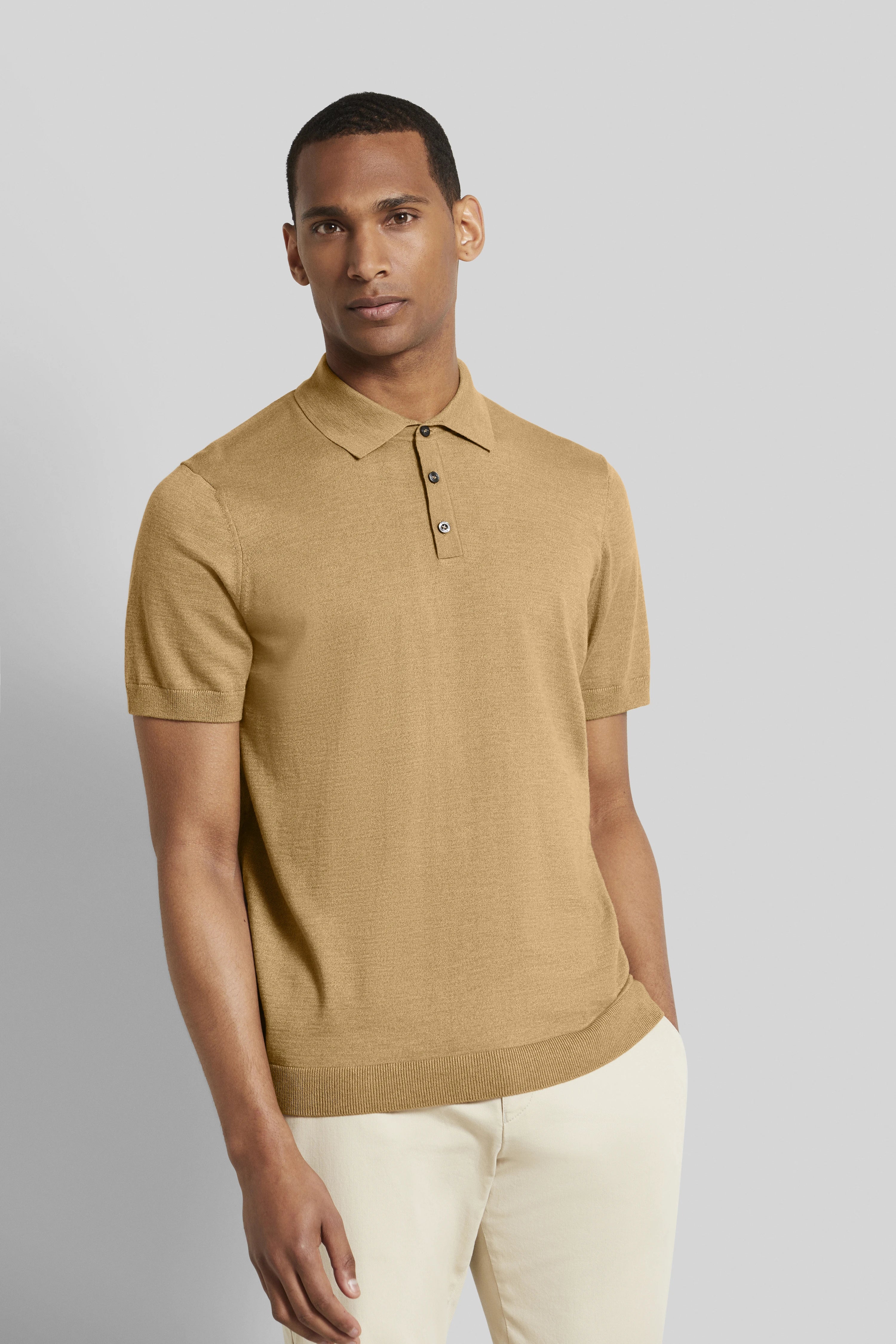Beige polo shirt by bugatti, worn by model, casual pose, paired with cream pants.