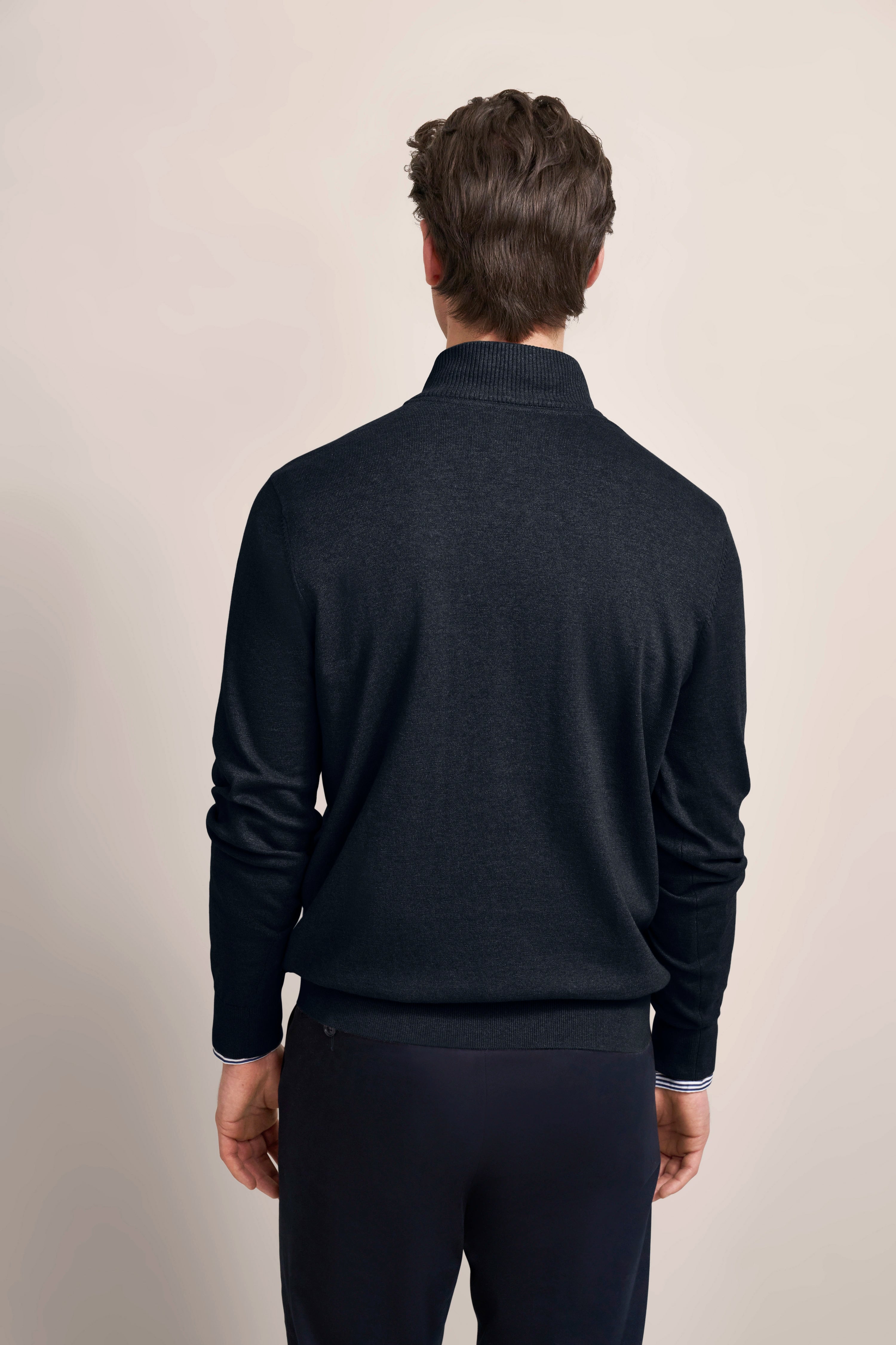 bugatti navy sweater, back view model, relaxed pose, embodies Italian elegance and sophistication.