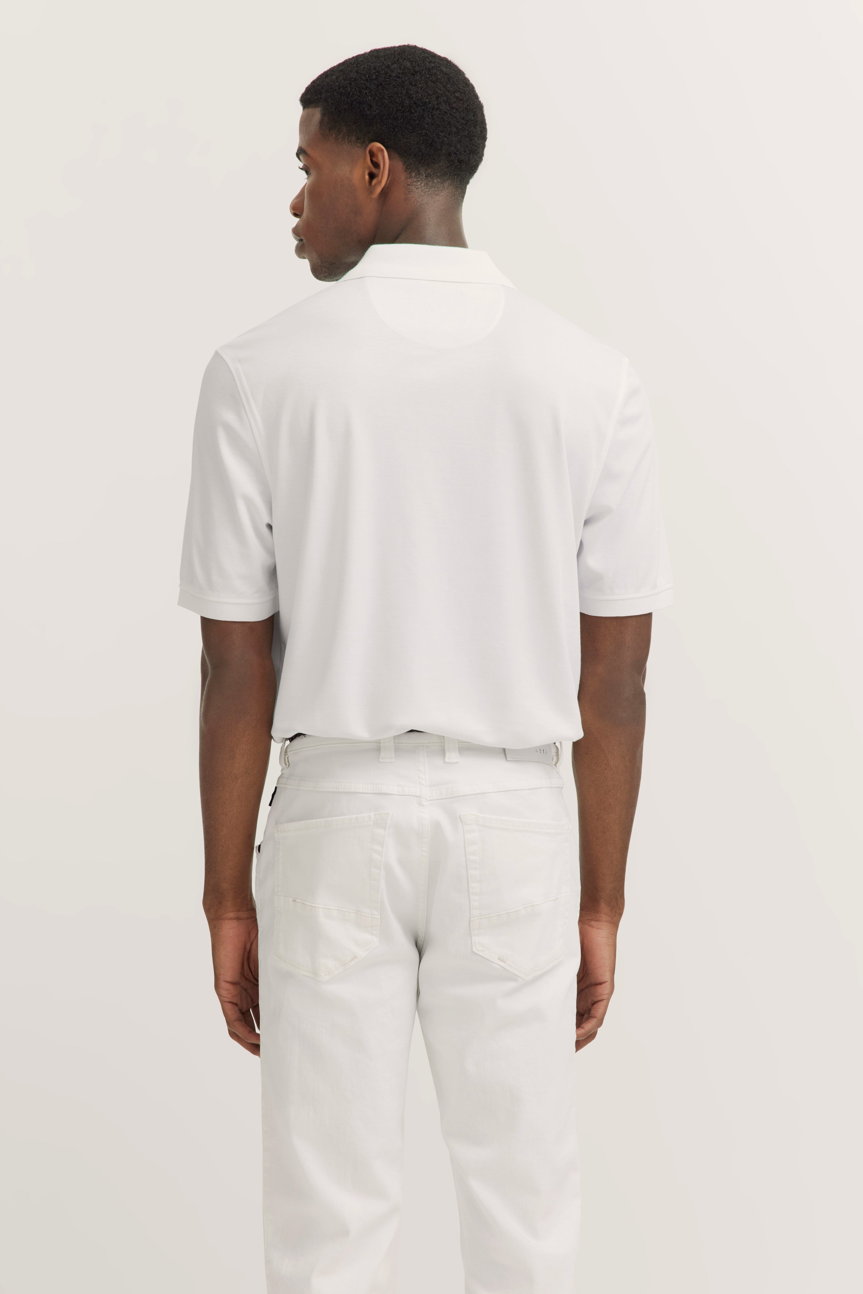 White bugatti polo and jeans on model from behind.