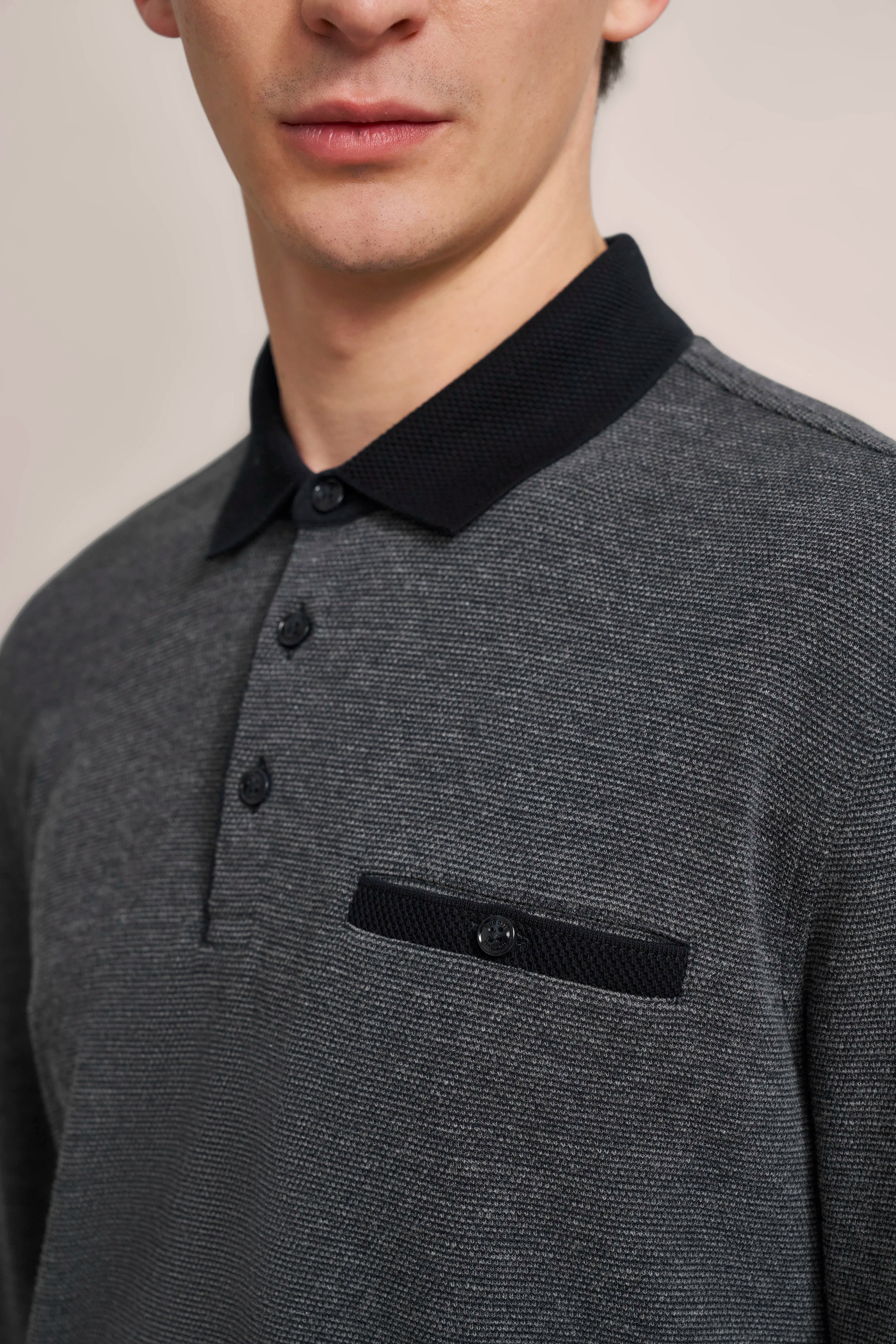 Gray bugatti polo shirt with black collar and buttons, bust model.